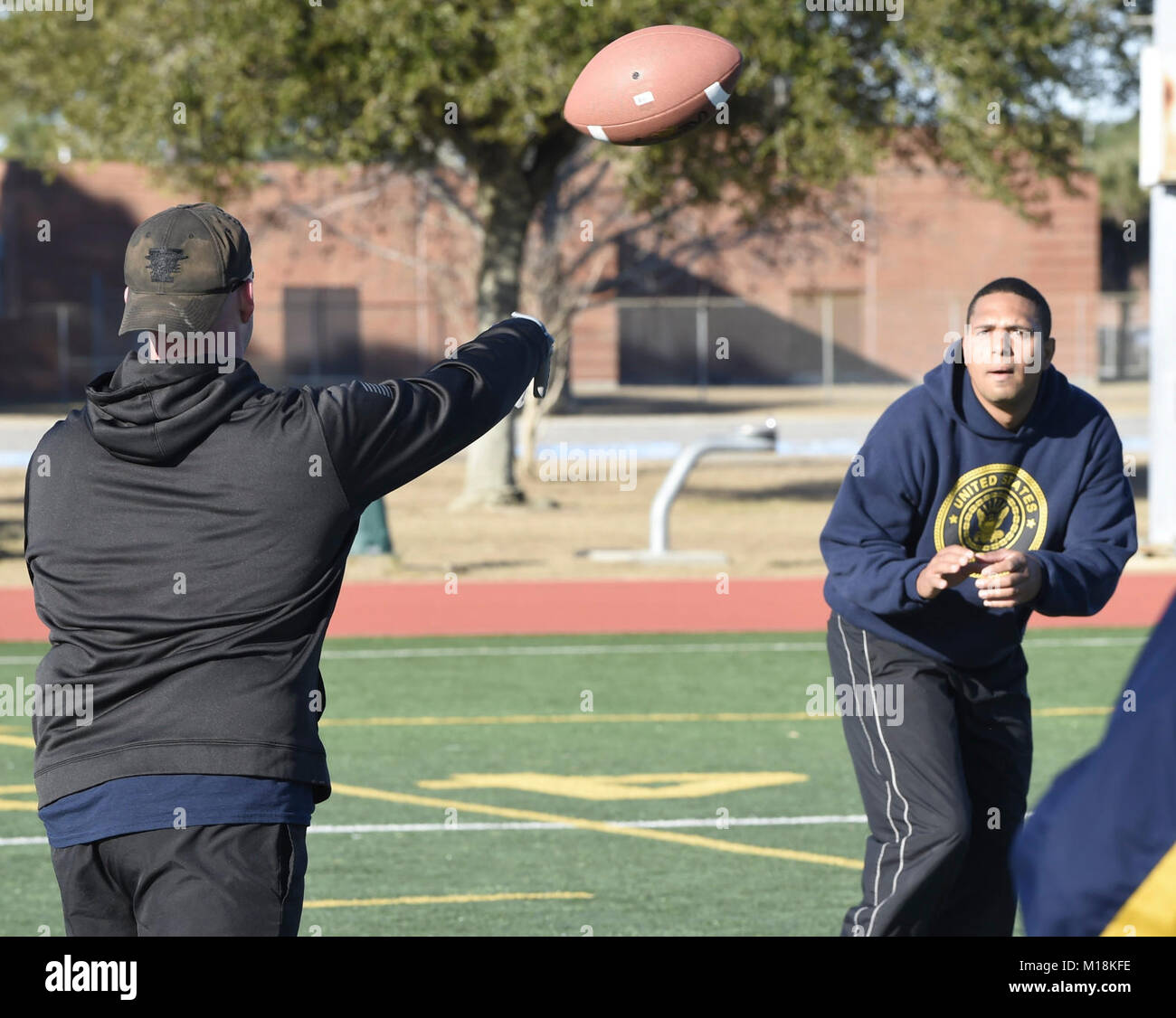 Fla. (Jan. 25, 2018) Center for Information Warfare Training (CIWT) staff participate in an Ultimate Football physical fitness session on board Naval Air Station Pensacola Corry Station, Florida. CIWT staff takes physical fitness seriously and regularly trains together to strengthen teamwork and maintain readiness. (U.S. Navy Stock Photo