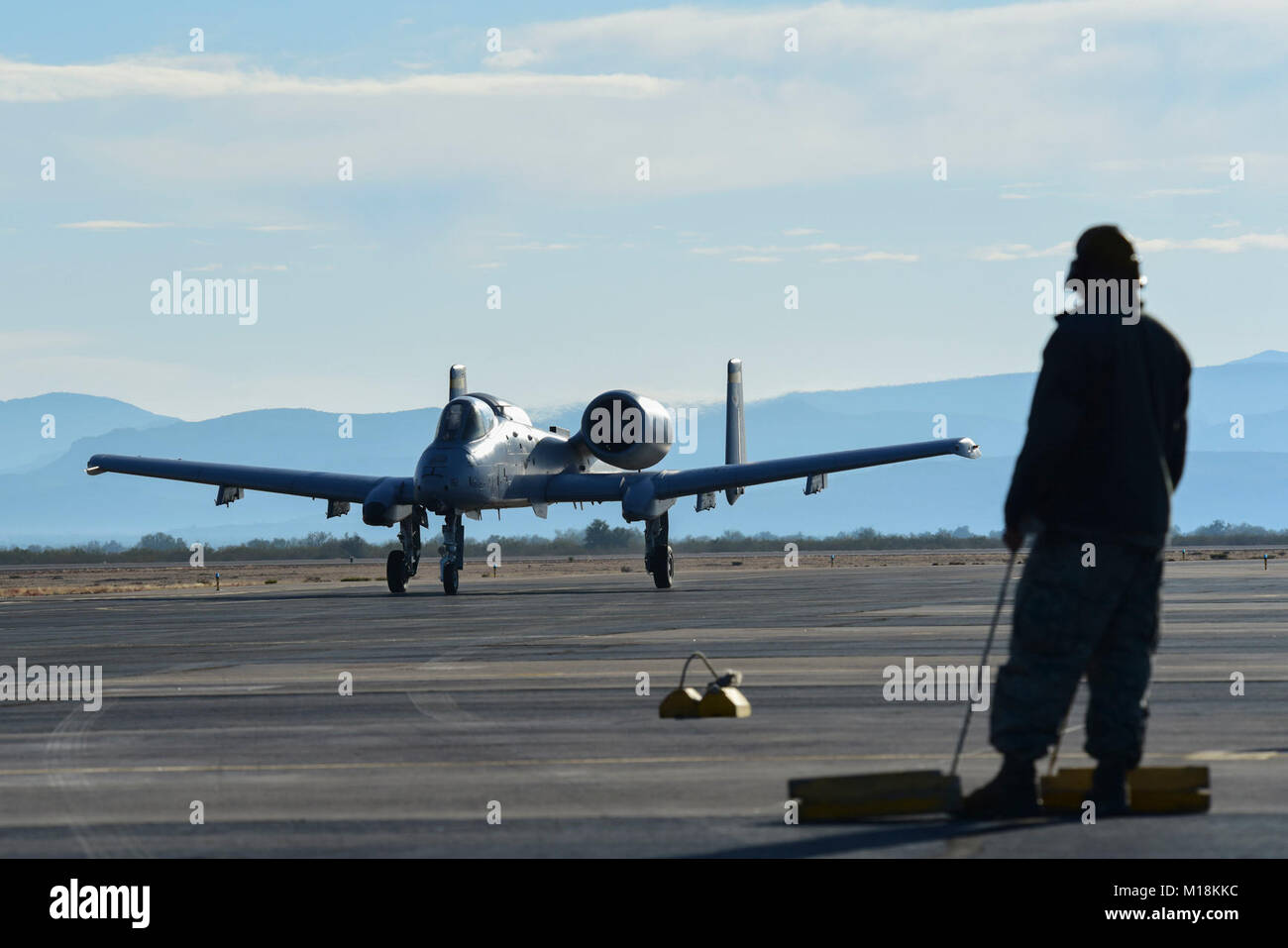 U.S. Air Force Staff Sgt. Andre Gonzales, A-10C Thunderbolt II Demonstration Team avionics systems craftsman, watches as an A-10 taxis during an off-station training flight at Gila Bend Auxiliary Airfield, Ariz., Dec. 18, 2017. As part of the requirements for certification as a demo team, the team must complete three off-station training flights. (U.S. Air Force Stock Photo