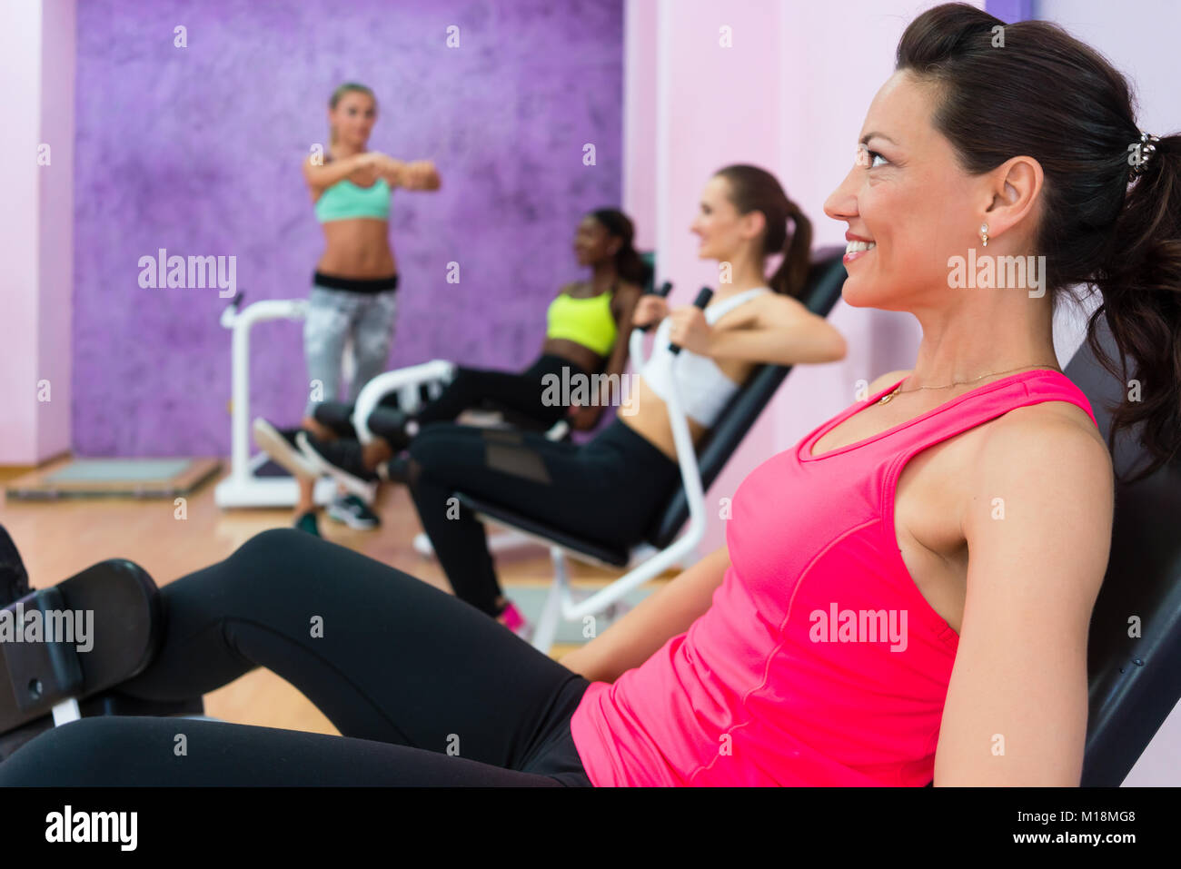 Fit woman listening to fitness instructor with sense of humor du Stock Photo