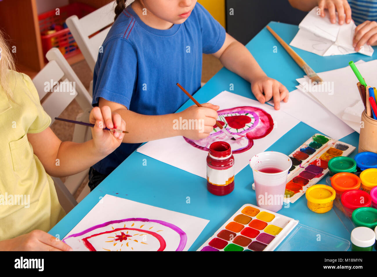 Small students children painting in art school class Stock Photo - Alamy