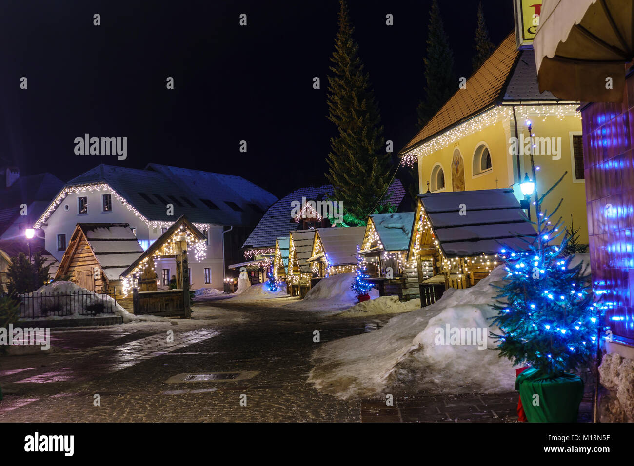 Kranjska Gora Christmas Decorated Square, Alpine village by night Stock Photo