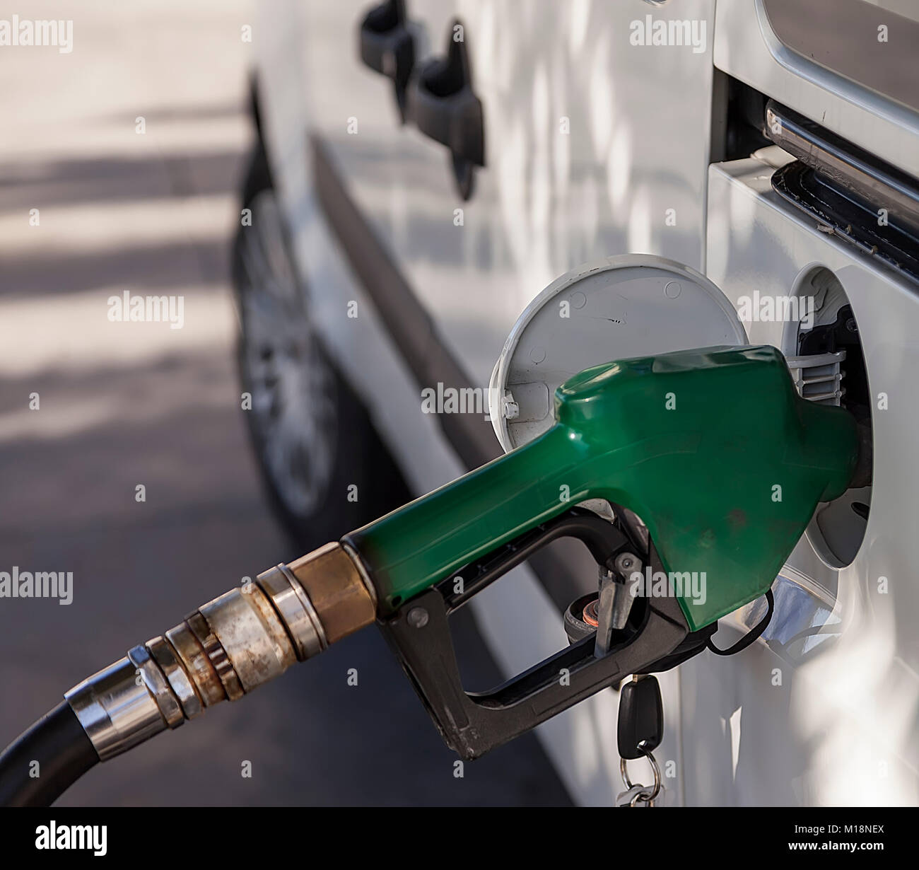Filling up  with fuel in the car, fuel pistol isolated.Stock Photo. Stock Photo
