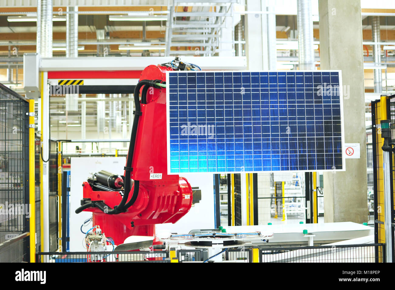 robots in the production of solar cells in the hitech industry - equipment in a factory Stock Photo