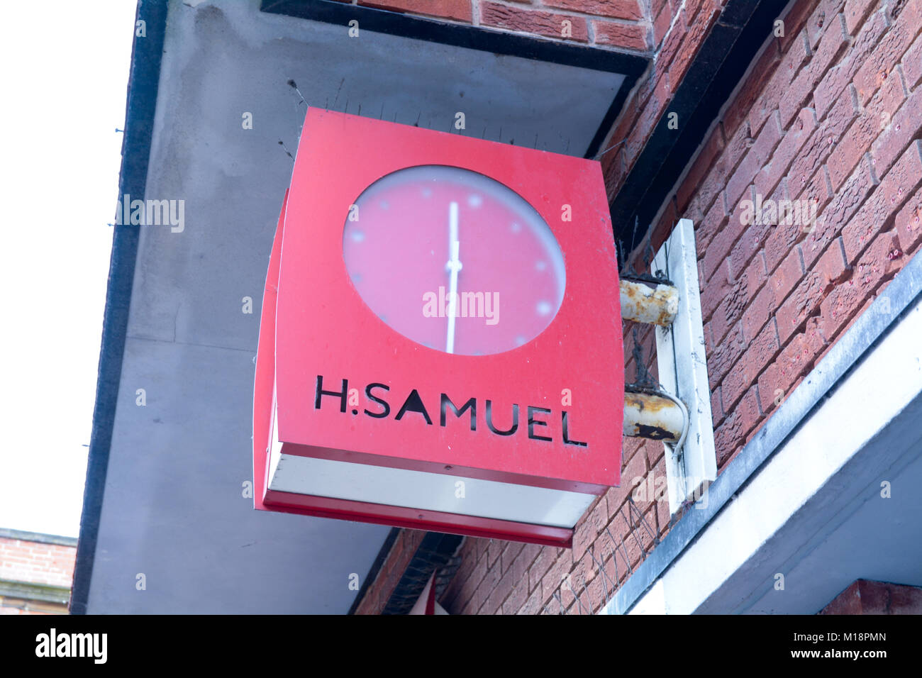 Sign with a built in clock outside H Samuels jewellers shop in Bedford town centre Bedfordshire England Stock Photo