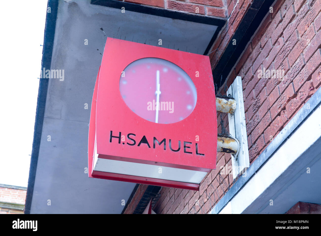 Sign with a built in clock outside H Samuels jewellers shop in Bedford