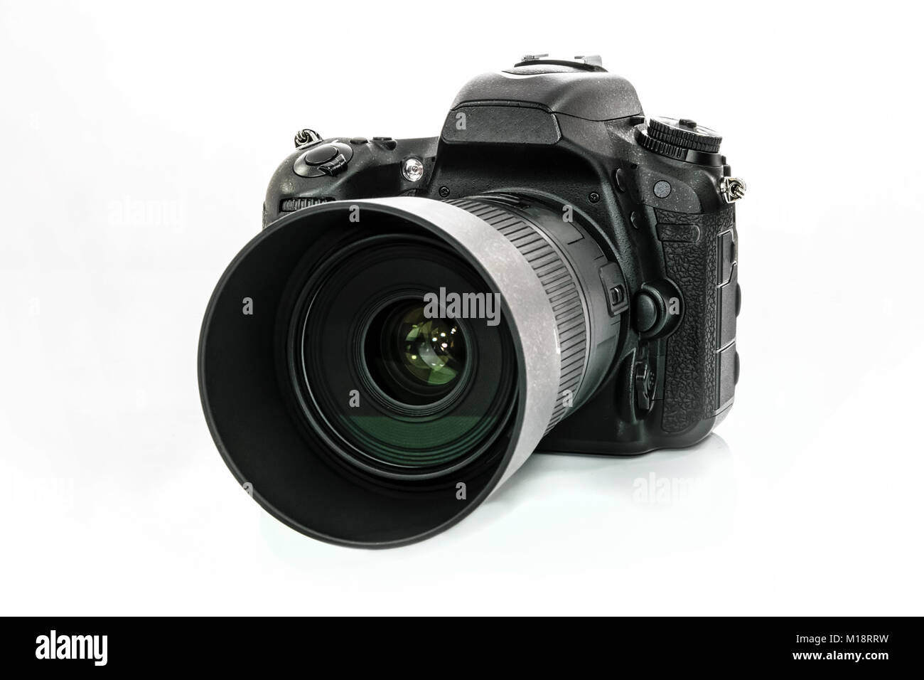 Professional generic DSLR camera isolated on white background in close