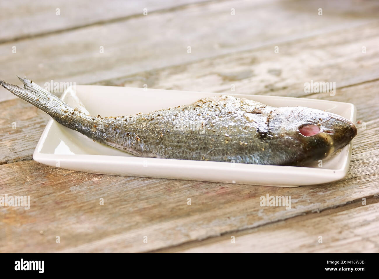 Raw fish prepared for cooking Stock Photo Alamy