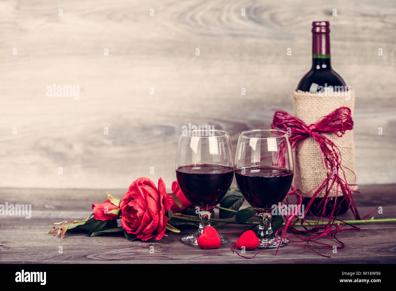Red Wine Bottle Two Glasses Of Wine Rose With Decoration By Red