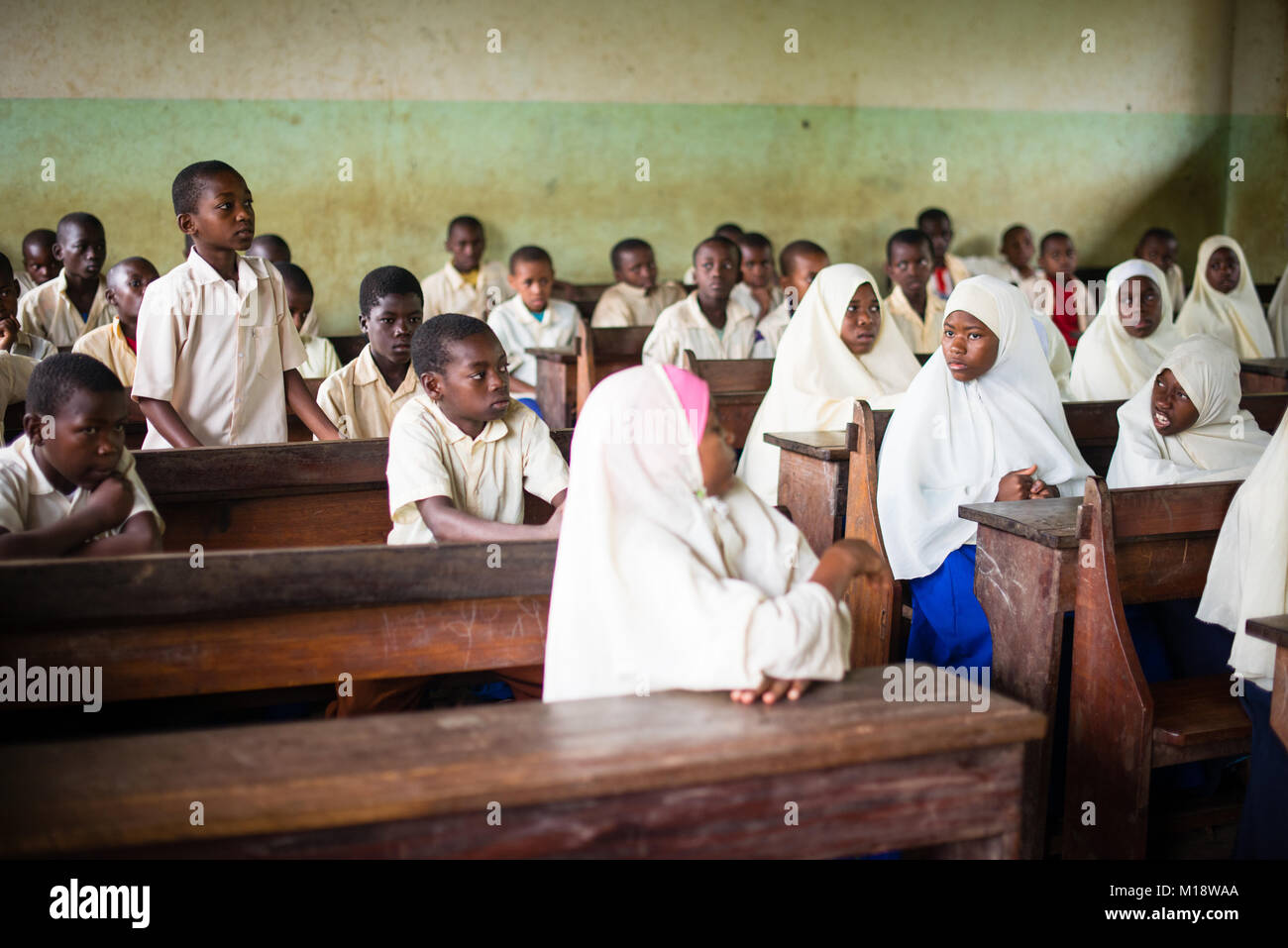 KENDWA, ZANZIBAR - JAN 10, 2018: Students in a classroom during English lesson, Primary school at Kendwa, Zanzibar Stock Photo