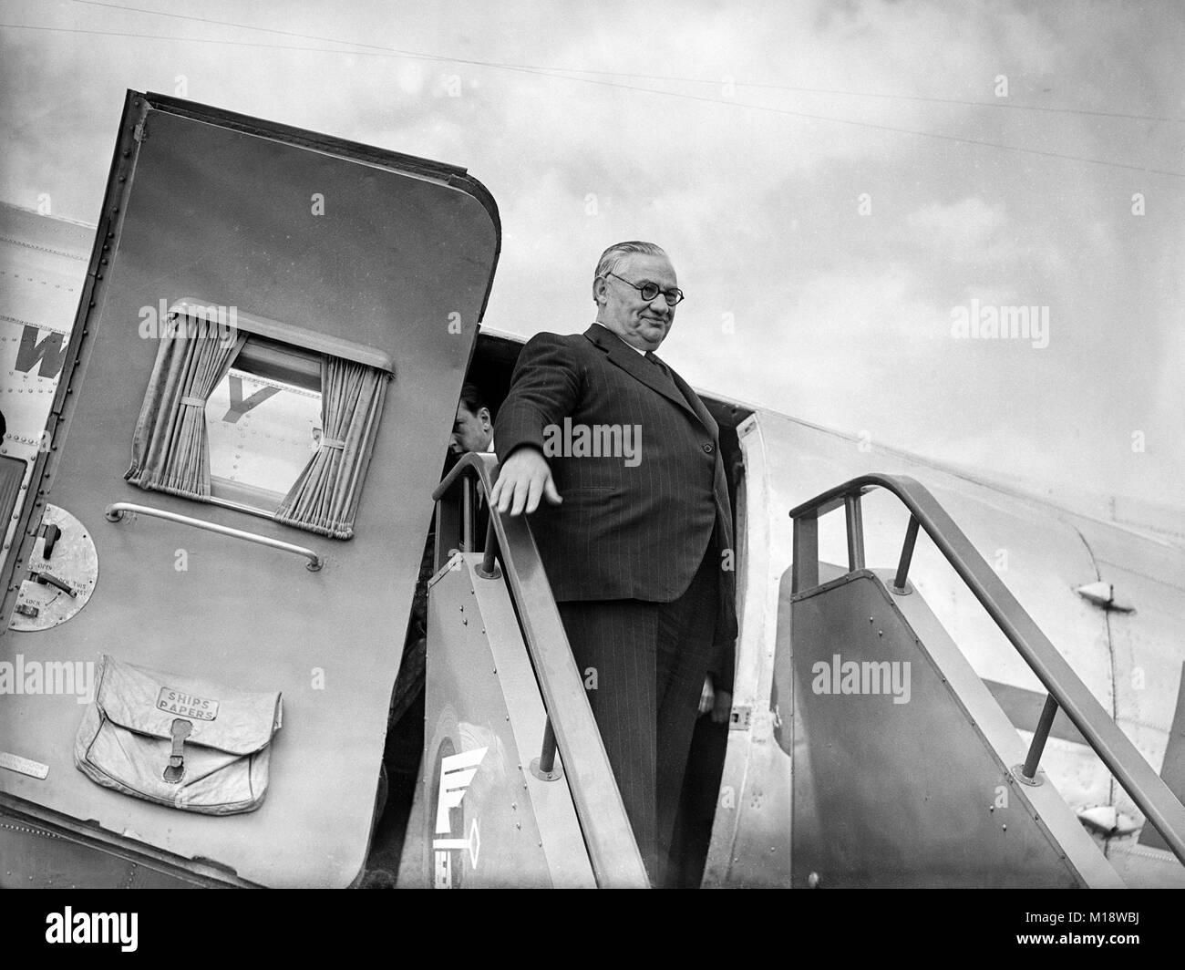 June 17th 1947. Britain's Foreign Secretary, Ernest Bevan, waves as he boards a plane at Northolt Airport in London, bound for Paris and talks with the French Government on the Marshall Plan for economic aid to Europe. Stock Photo