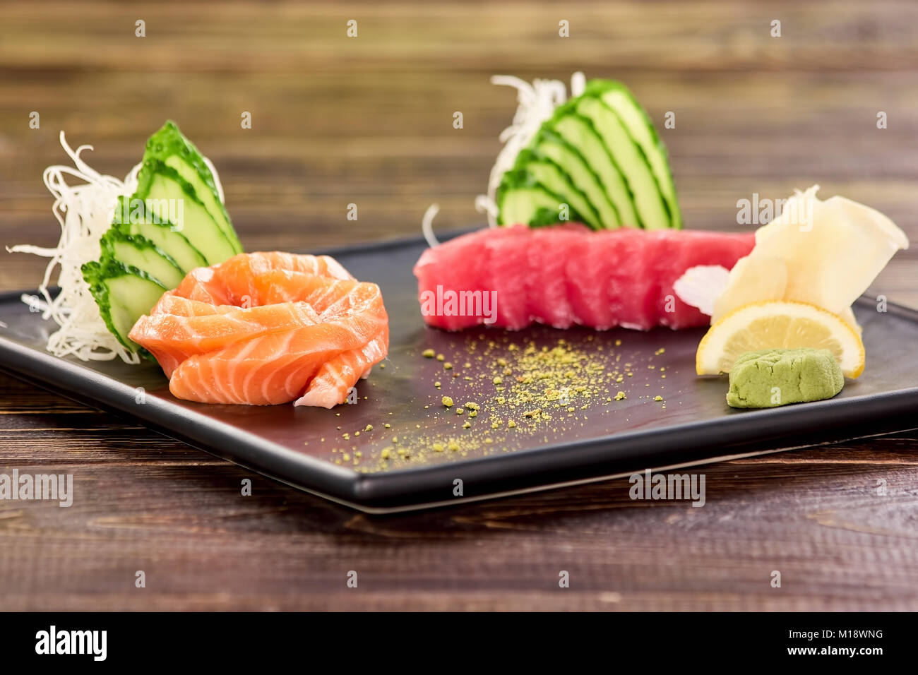 Juicy sliced salmon and tuna with side dish Stock Photo Alamy