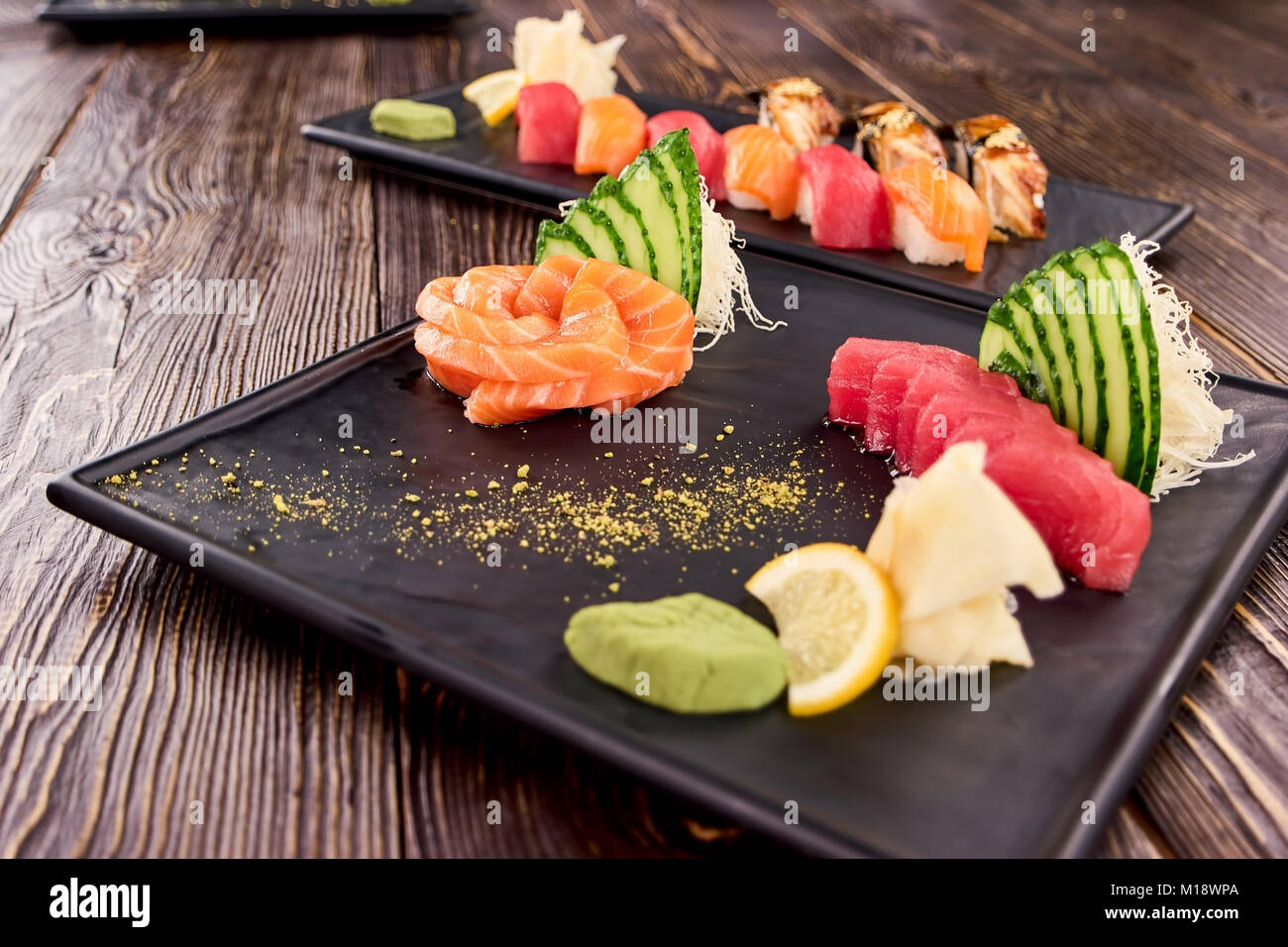 Nigiri sushi dish on black rectangle plate. Stock Photo