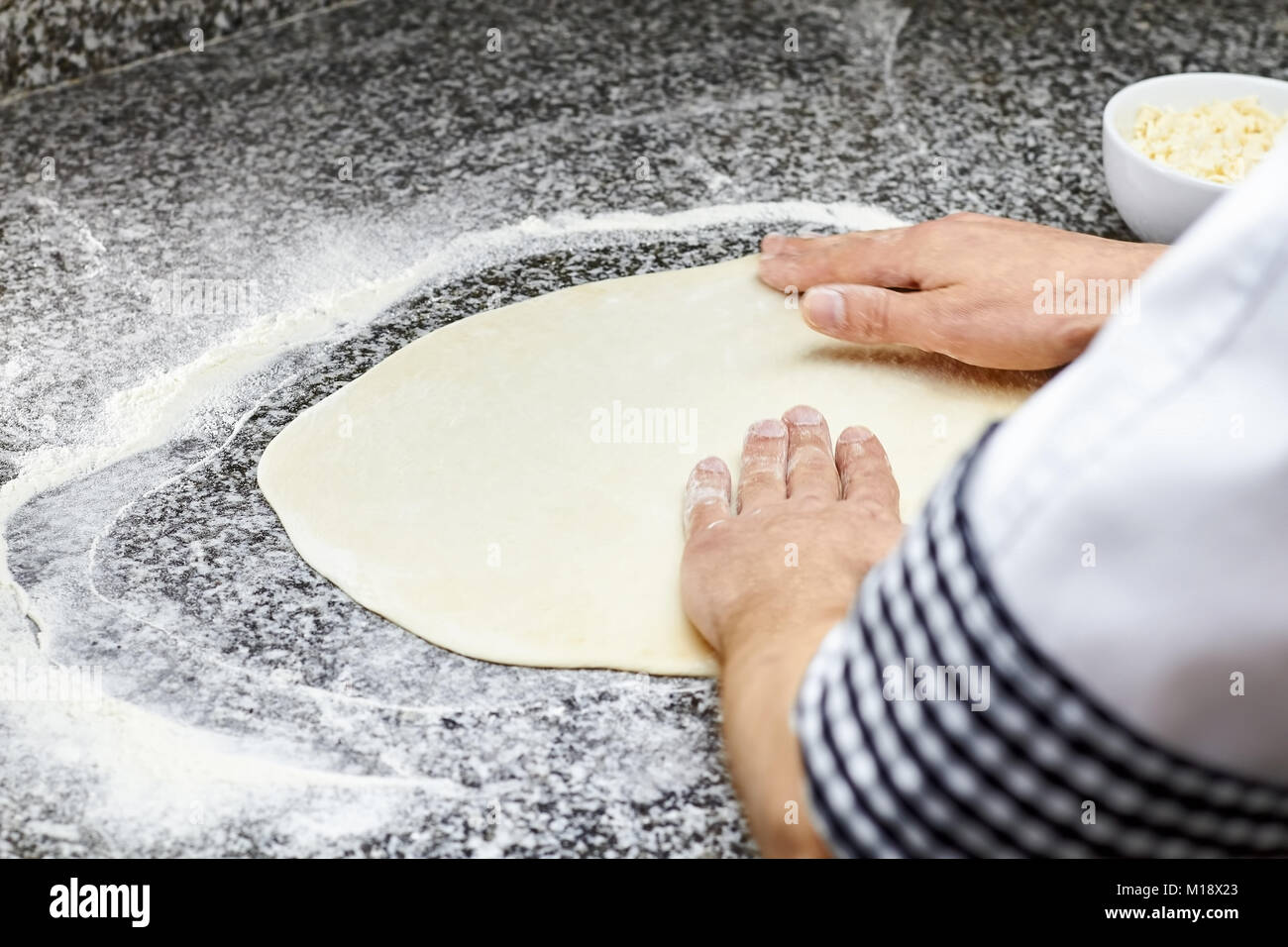 Kneading pizza dough Stock Photo - Alamy