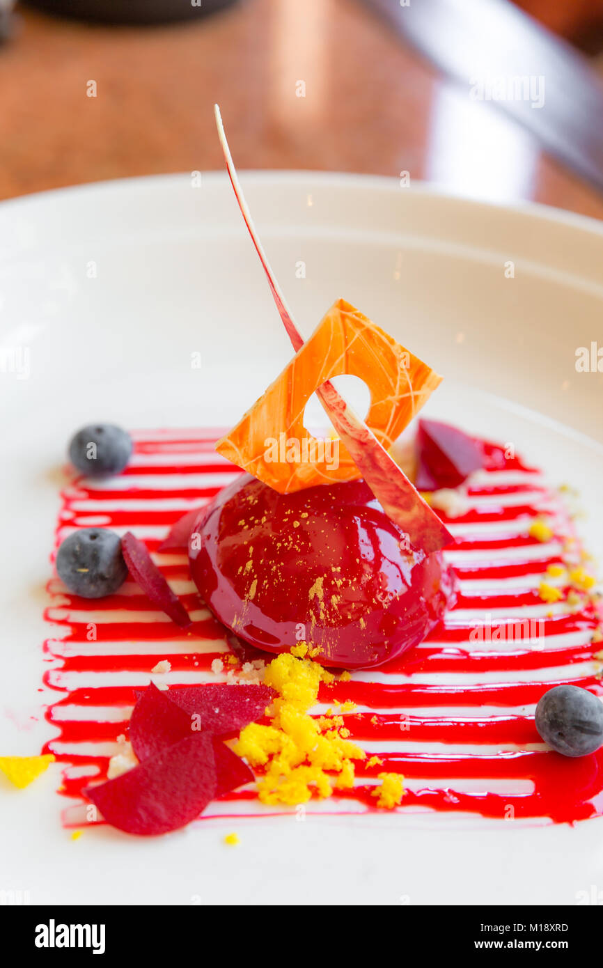 ricotta cheesecake with strawberry sauce Stock Photo Alamy