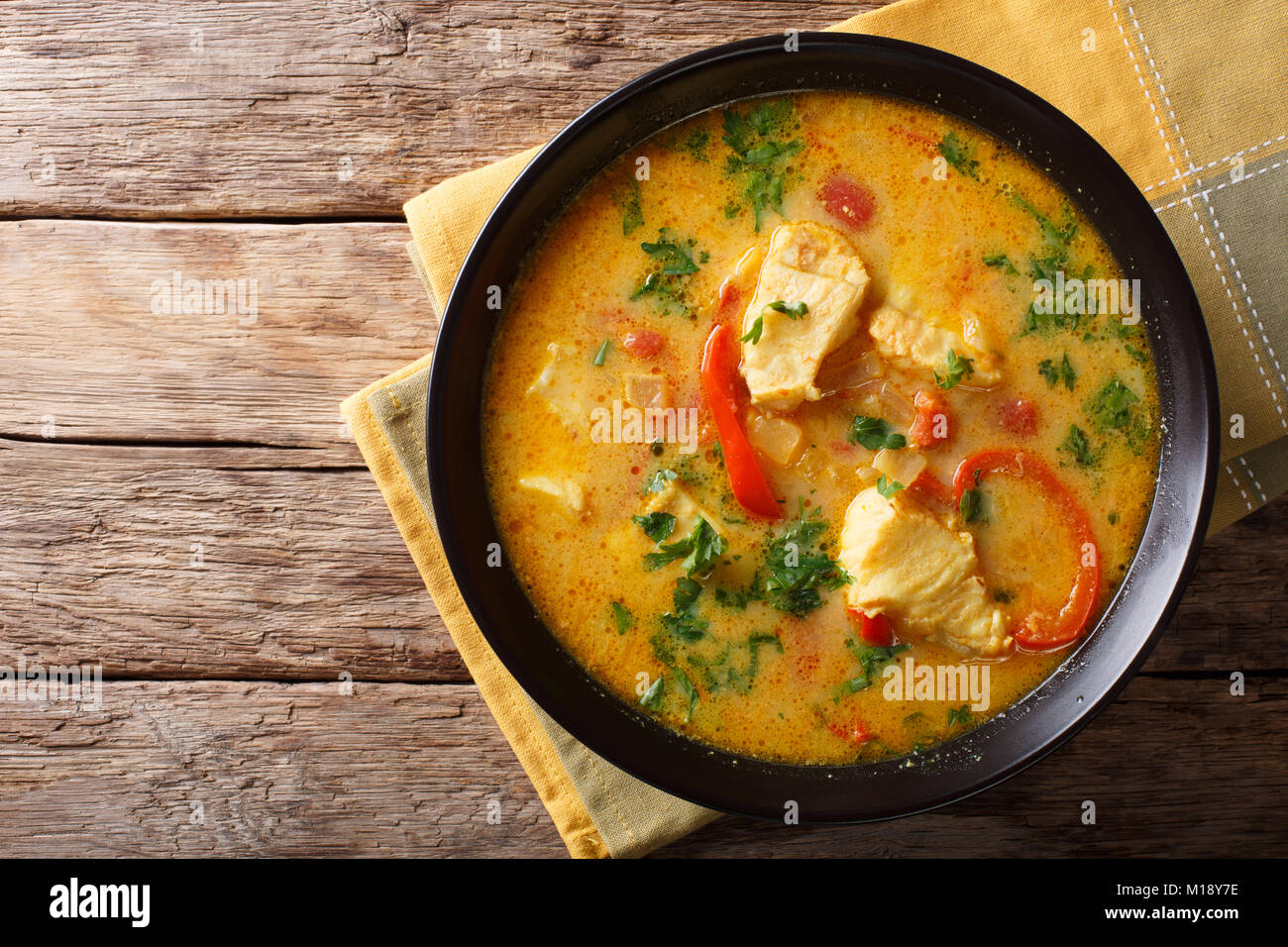 Brazilian food Moqueca Baiana of fish and bell peppers in spicy