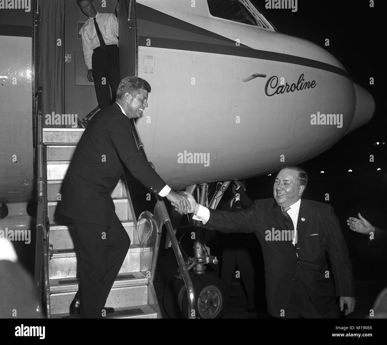 Senator John F. Kennedy leaving Chicago O’Hare airfield, says goodbye to Mayor Richard J. Daley, September 26, 1960. The Caroline was a 1948 Convair CV-240 aircraft purchased by Joseph Kennedy from American Airlines and was the first private aircraft used in a U.S. presidential campaign. Stock Photo