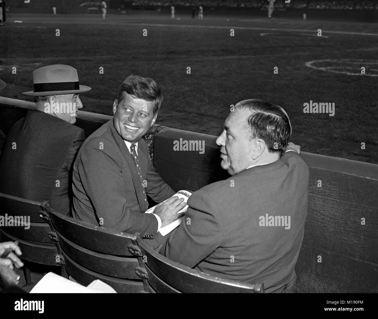 Senator John Kennedy with Mayor Richard J. Daley and Commissioner of Baseball Happy Chandler at the 2nd game of the World Series. Chicago, Comiskey Park. Oct. 2, 1959.    Dodgers 4 - Sox 3. Stock Photo
