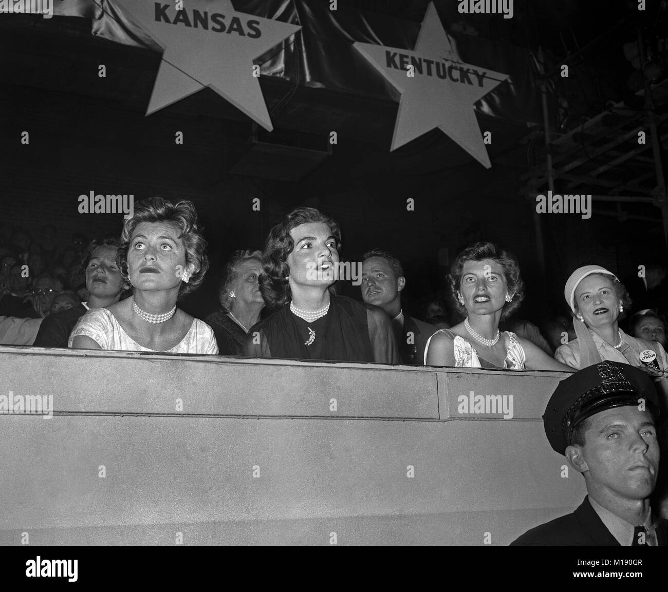 Kennedy Ladies.  Jean Kennedy Smith, Jacqueline Bouvier Kennedy, Eunice Kennedy Shriver, Lady Bird Johnson are watching  presidential candidate John F. Kennedy being presented by Mayor Daley at the Chicago Stadium for a televised Democratic rally. November 4, 1960. Stock Photo