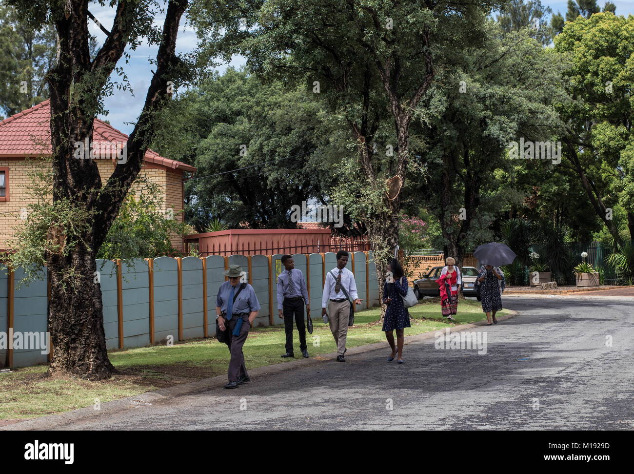 Johannesburg, South Africa - unknown members of the Jehovah's Witness sect work the streets of the city, image in landscape format Stock Photo