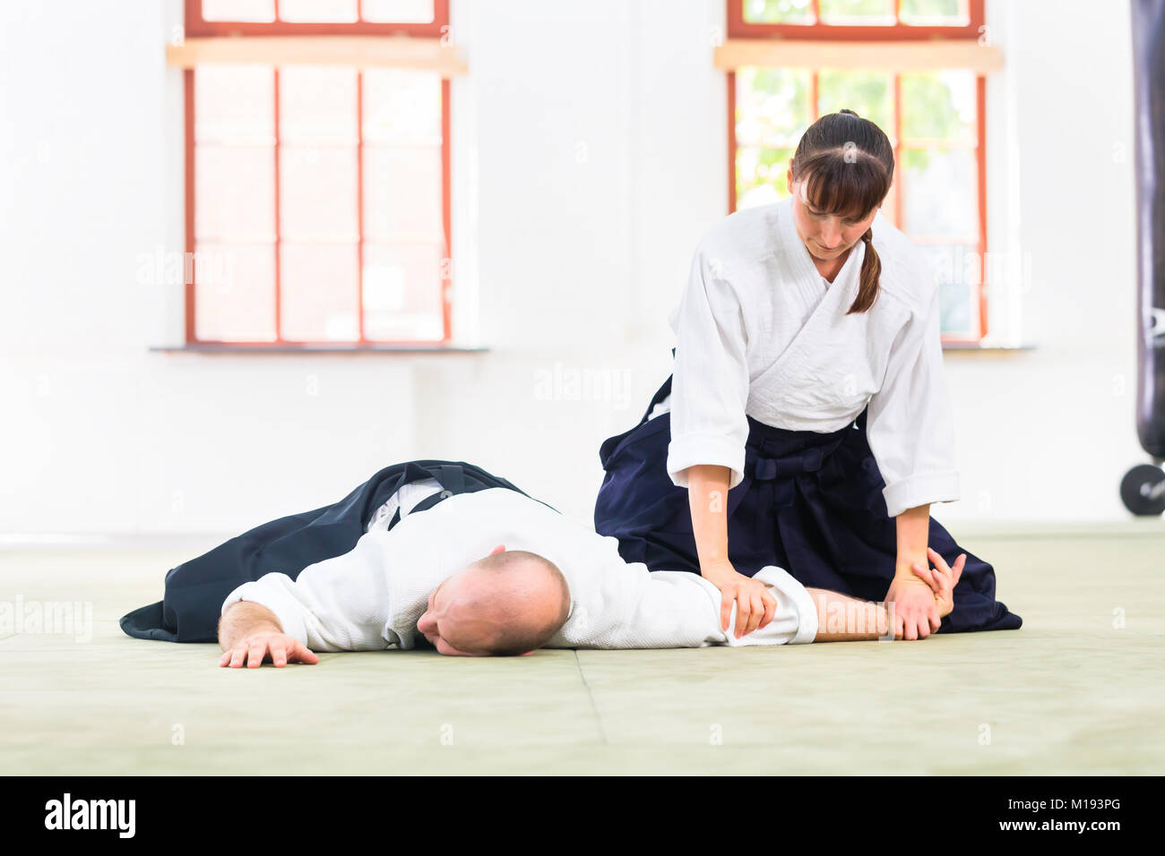Man and woman fighting at Aikido martial arts school Stock Photo