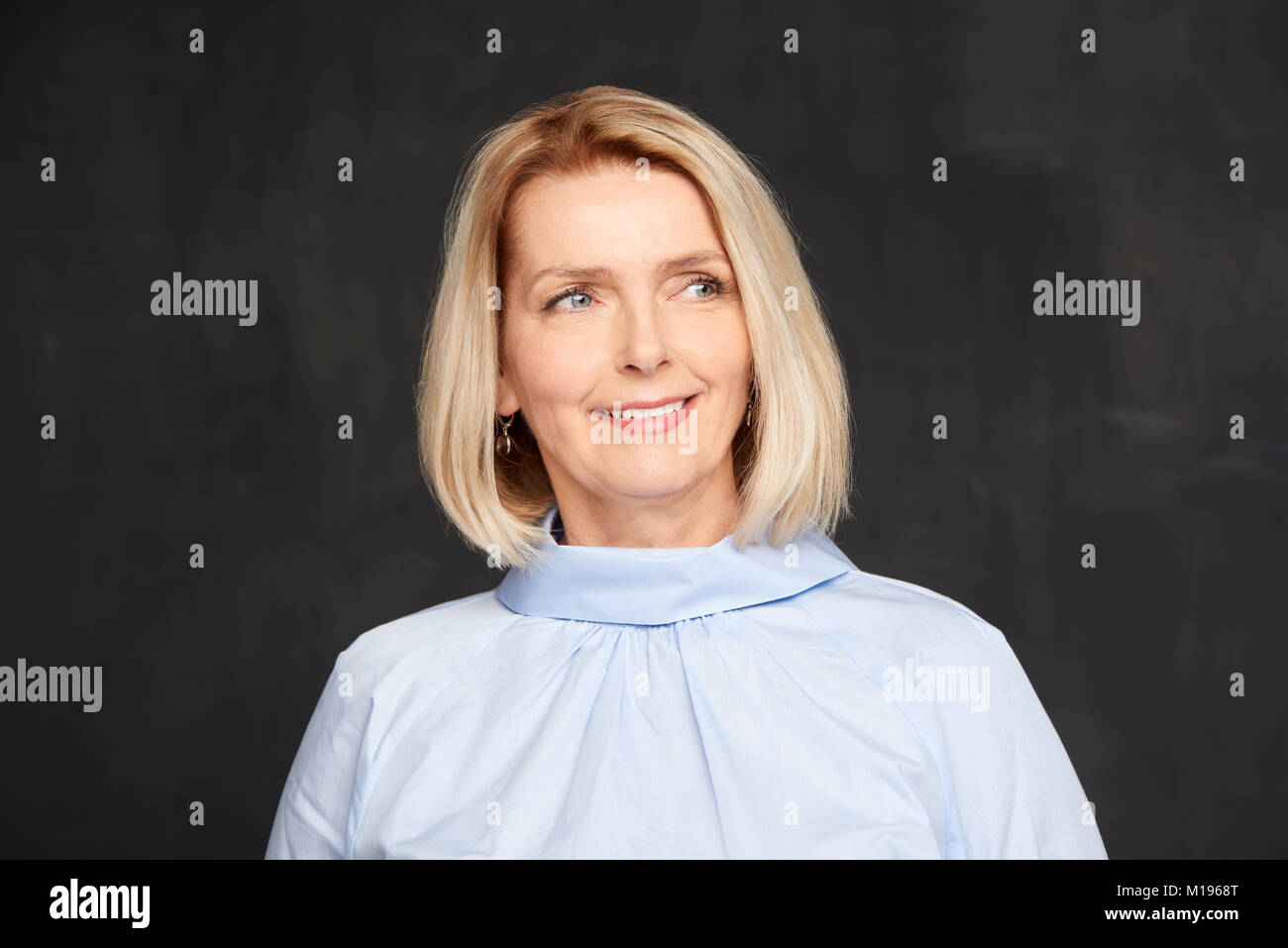 Beautiful mature woman posing in hi-res stock photography and images ...