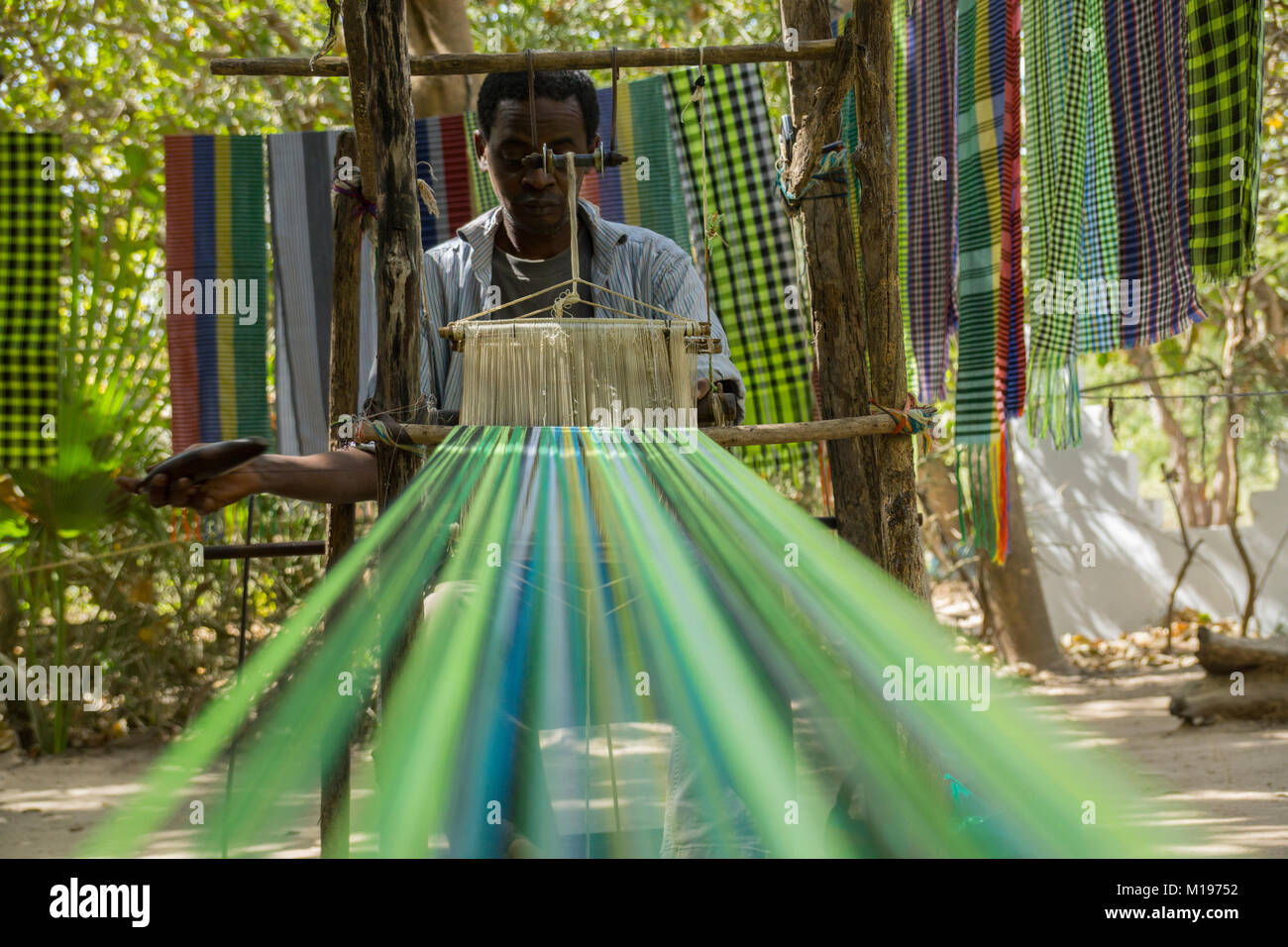 An african male shows traditional weaving in Makasutu forest, The Gambia, Africa Stock Photo