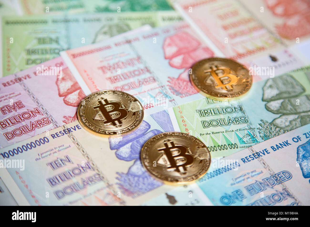 Bitcoins over the background made of Zimbabwe currency Stock Photo - Alamy