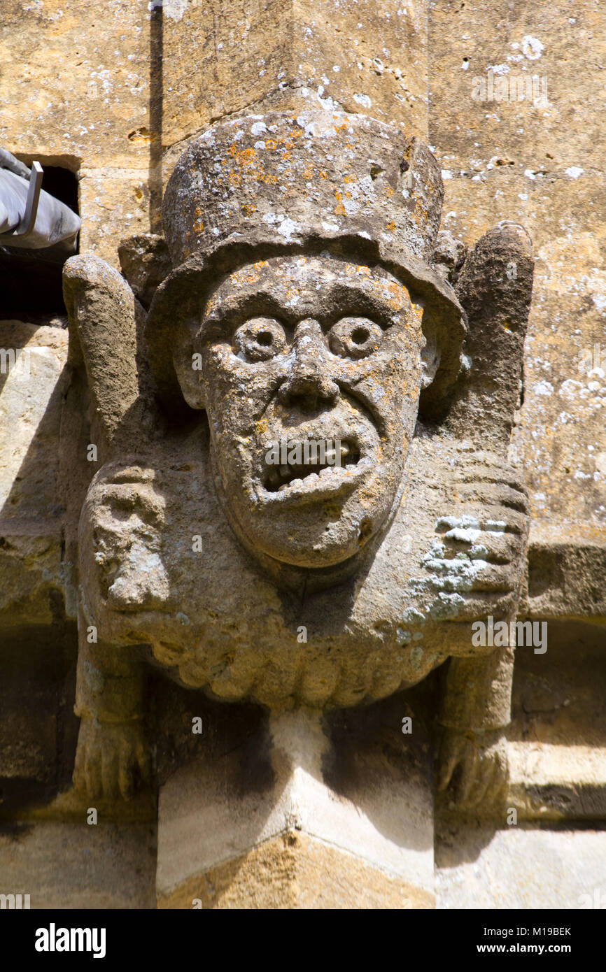 Grotesque gargoyles on the historic Cotswold church at