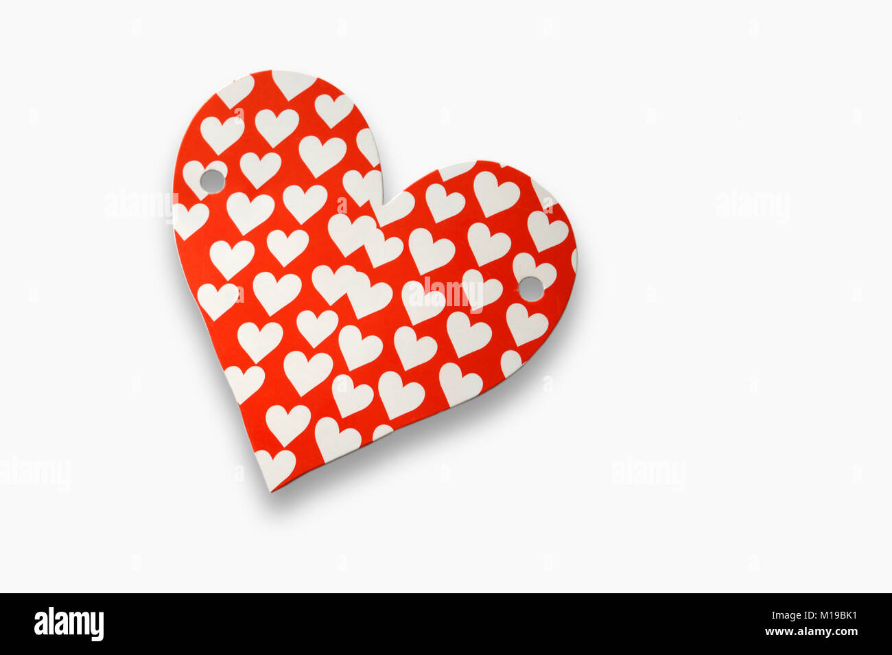 Red paper heart with white figures on white background Stock Photo - Alamy