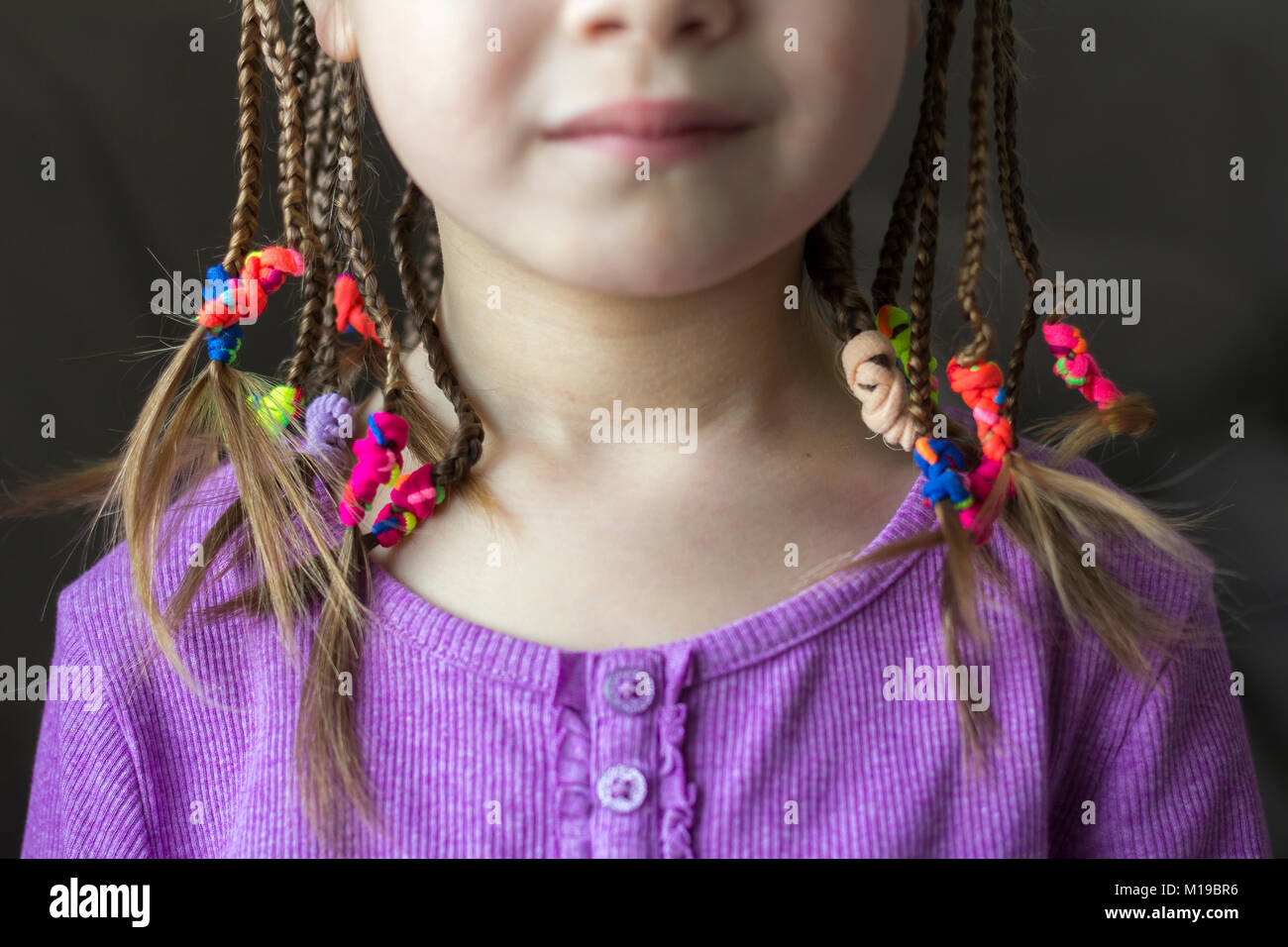 Close Up Of Braid Hair Of Little Girl With Colorful Rubber