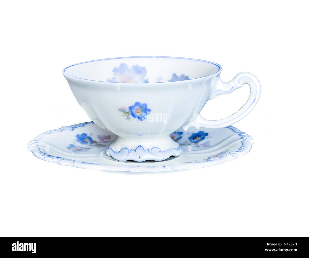 Vintage antique elegant porcelain tea cup on saucer isolated on a white background isolated Stock Photo