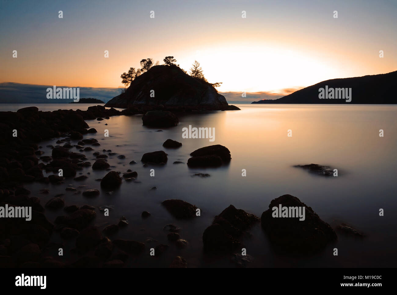 Island at sunset Stock Photo