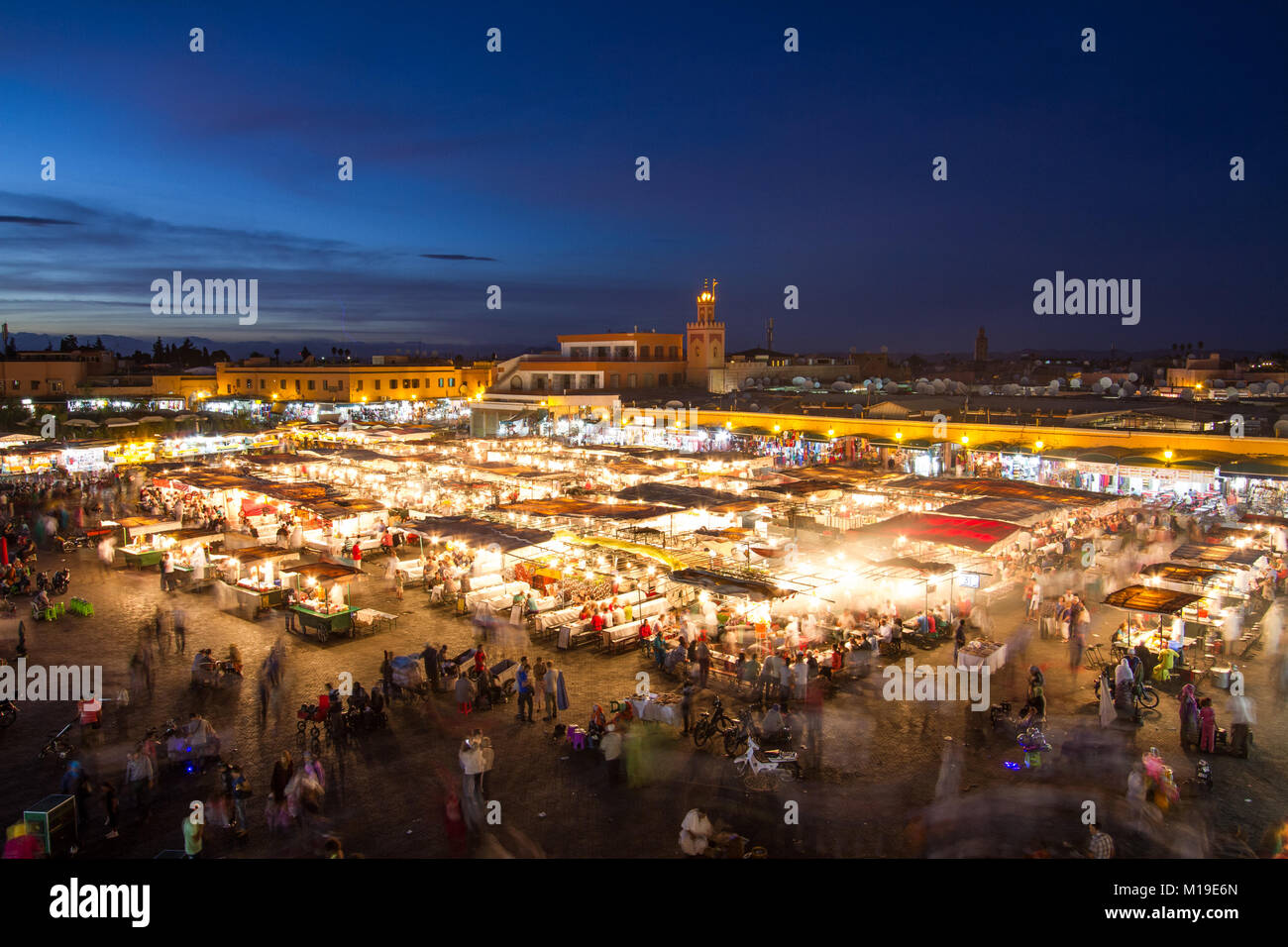 Jamaa el Fna market square at dusk, Marrakesh, Morocco, north Africa. Jemaa el-Fnaa, Djema el-Fna or Djemaa el-Fnaa is a famous square and market plac Stock Photo