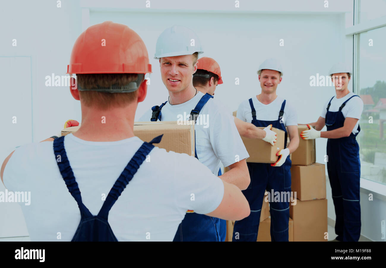 workers unload boxes Stock Photo - Alamy