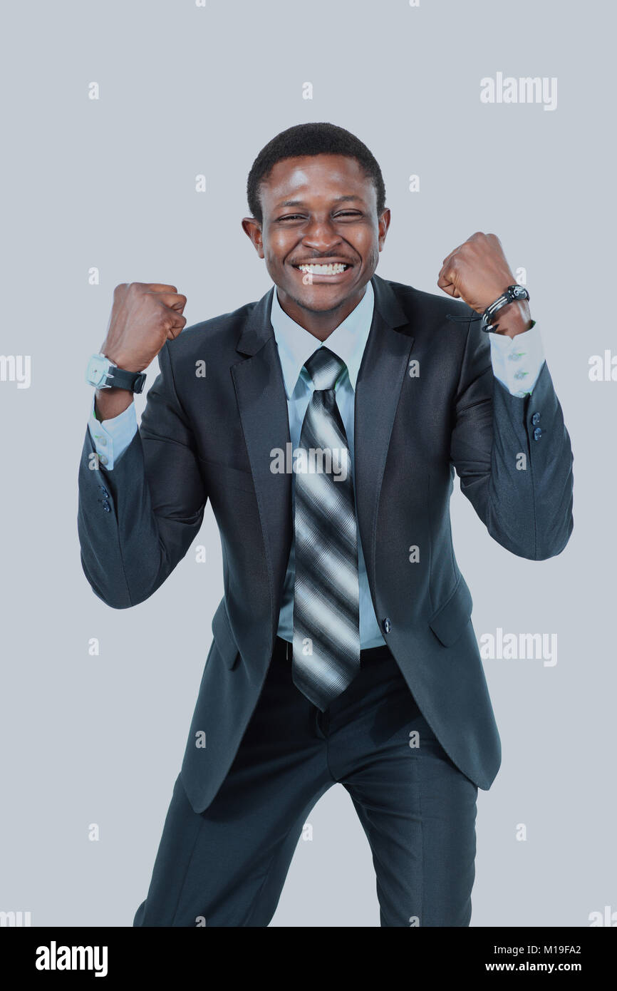 Portrait of an excited businessman with arms raised in success on white ...