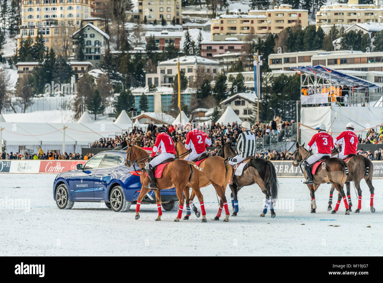 St.Moritz, Switzerland. 28th Jan, 2018. Members of the 'Cartier' team behind a Maserati Sponsor car during the final of the Snow Polo World Cup 2018 game on January 28, 2018 in St Moritz, Switzerland Credit: travelbild/Alamy Live News Stock Photo