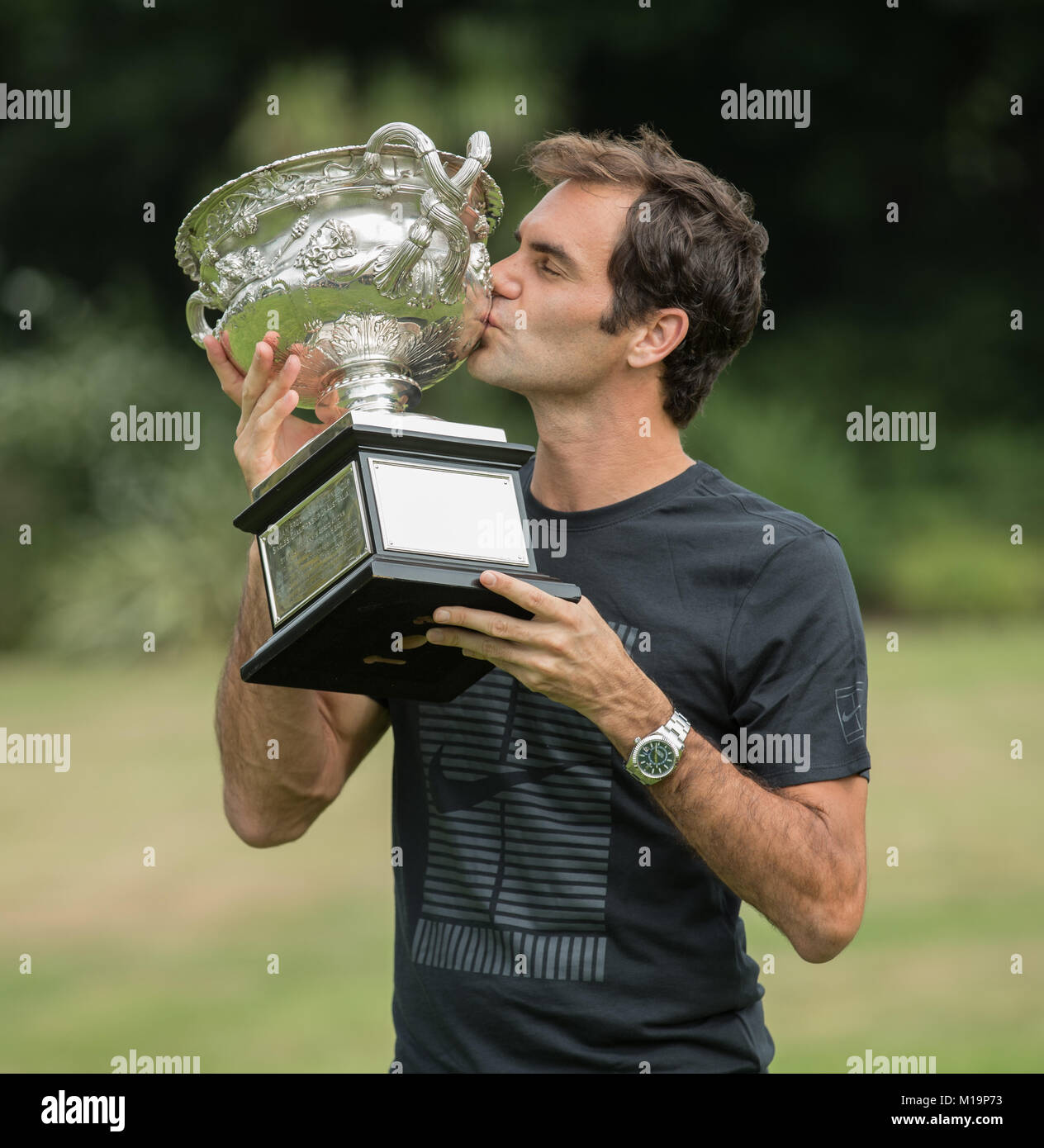 Melbourne, Australia. 29th Jan, 2018. Roger Federer of Switzerland kisses his Australian Open trophy, the Norman Brookes Challenge Cup at the Government House in Melbourne, Australia, Jan. 29, 2018. Credit: Zhu Hongye/Xinhua/Alamy Live News Stock Photo