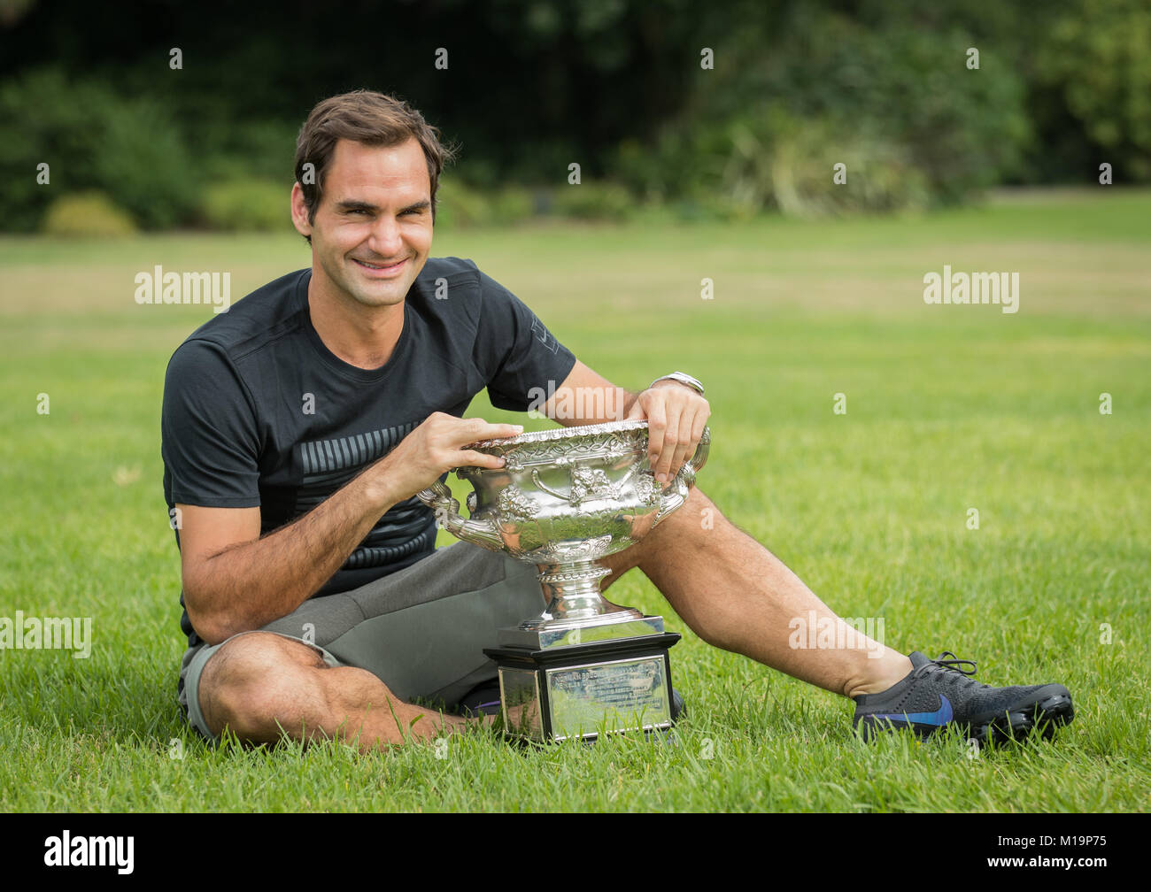 Melbourne, Australia. 29th Jan, 2018. Roger Federer of Switzerland poses with his Australian Open trophy, the Norman Brookes Challenge Cup at the Government House in Melbourne, Australia, Jan. 29, 2018. Credit: Zhu Hongye/Xinhua/Alamy Live News Stock Photo