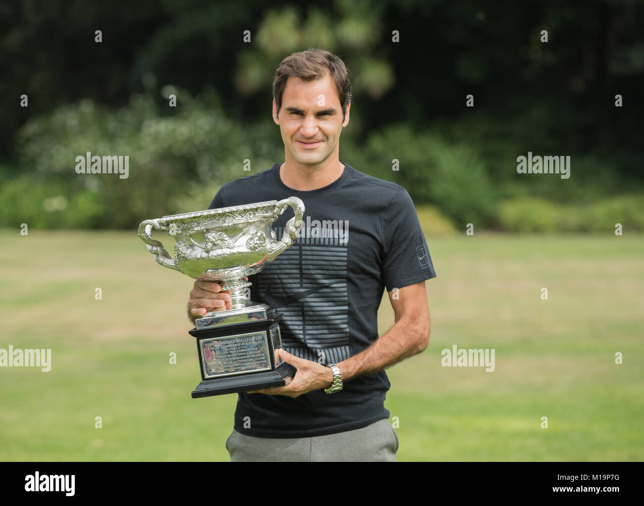Melbourne, Australia. 29th Jan, 2018. Roger Federer of Switzerland poses with his Australian Open trophy, the Norman Brookes Challenge Cup at the Government House in Melbourne, Australia, Jan. 29, 2018. Credit: Zhu Hongye/Xinhua/Alamy Live News Stock Photo