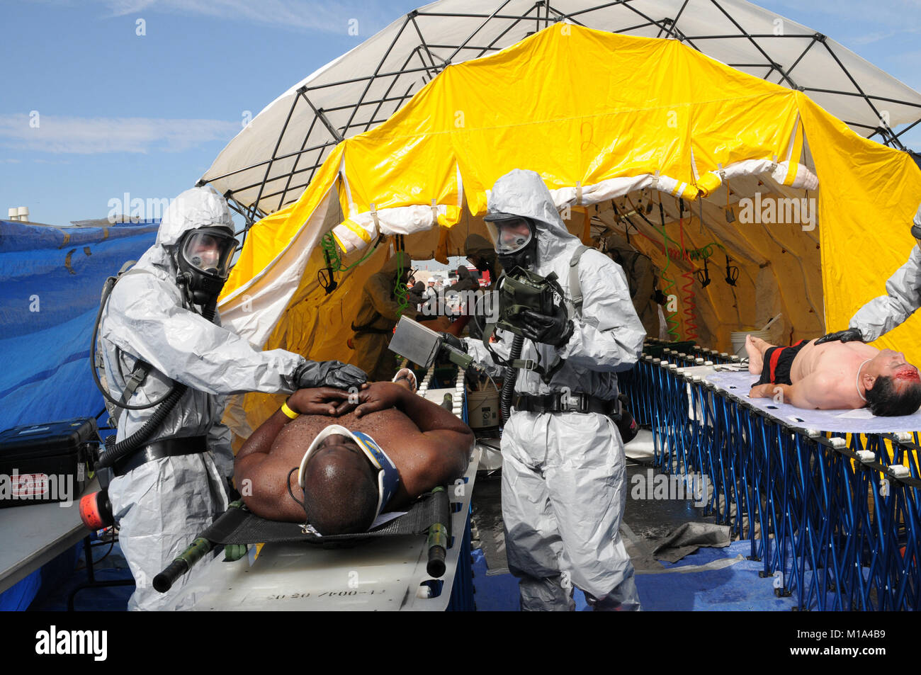 111104-Z-WM549-005 Brothers Spcs. Benjamin and Stephen Lindsey, members of the 235th Engineer Company, 579th Engineer Battalion, 49th Military Police Brigade, California Army National Guard, decontaminate a civilian Nov. 4 during the 2011 Arizona Statewide Vigilant Guard Exercise in Phoenix. The exercise is designed to enhance the California National Guard’s disaster response capabilities to devastating state emergencies such as an improvised nuclear device detonation. Vigilant Guard is preparing the 49th Military Police Brigade to assume the role as the Federal Emergency Management Agency’s R Stock Photo