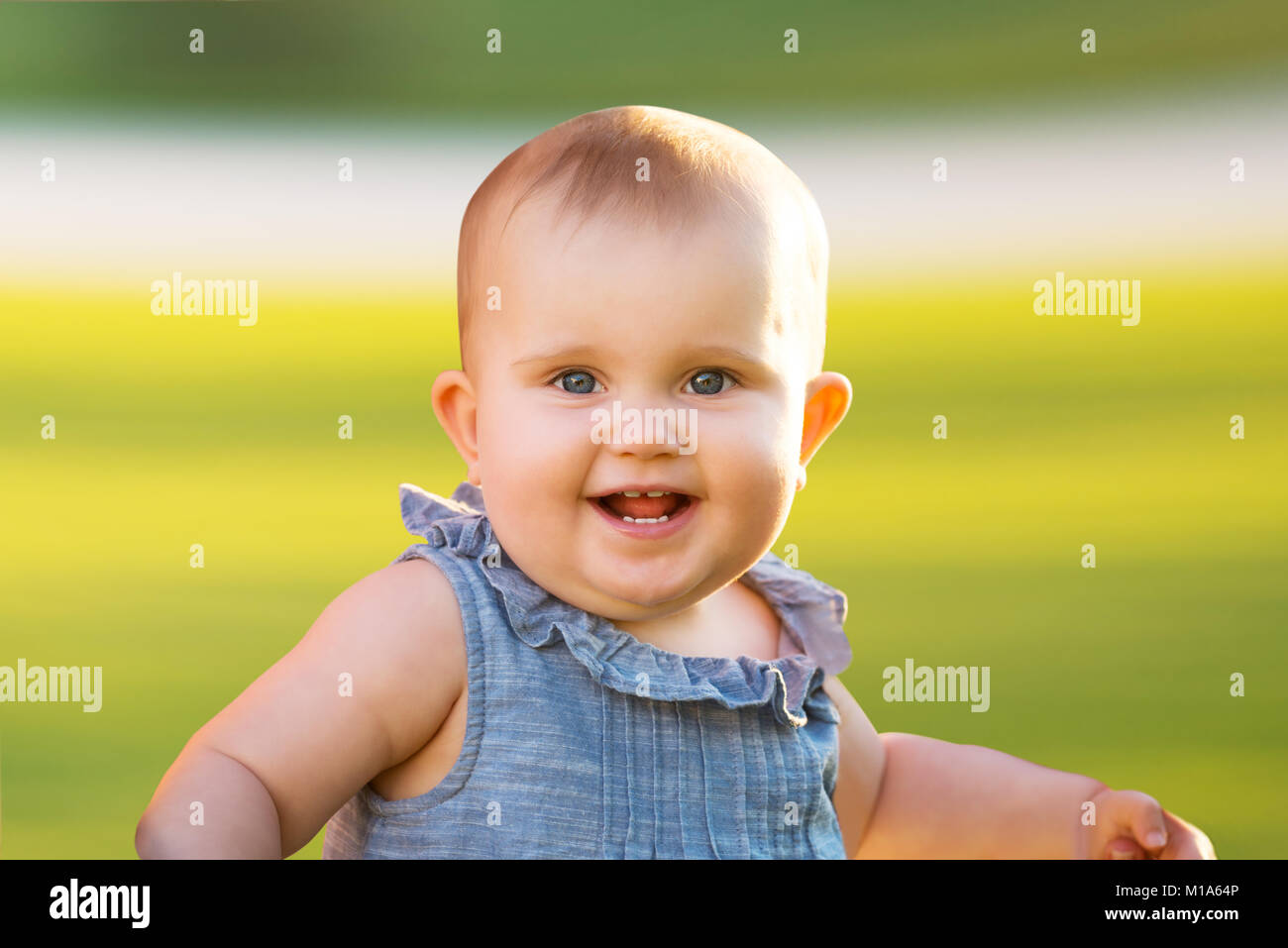 Portrait Of A Smiling Cute Infant Baby Girl Stock Photo