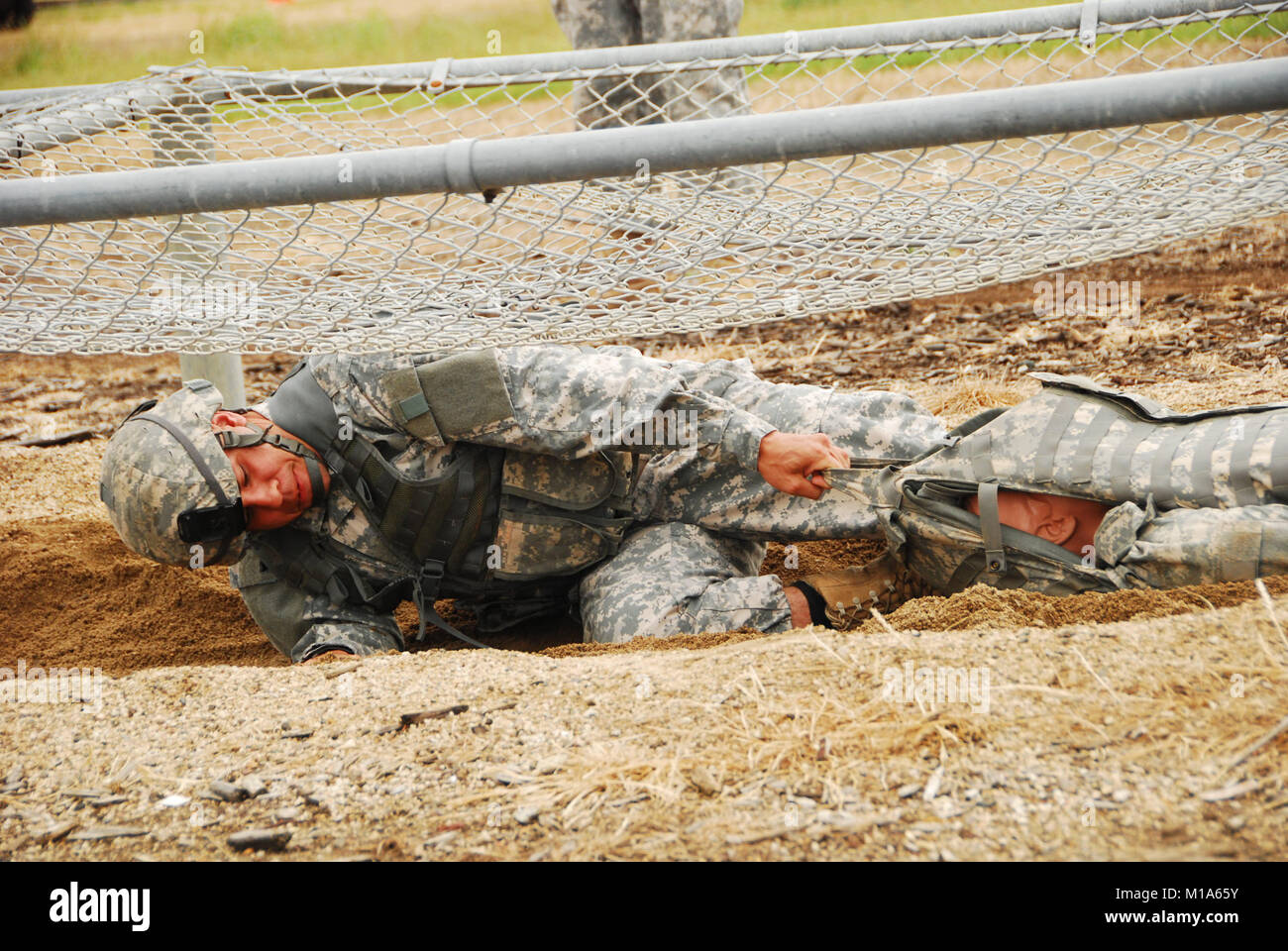 Staff Sgt. Demetrius McCowan, California Army National Guard, drags a ...