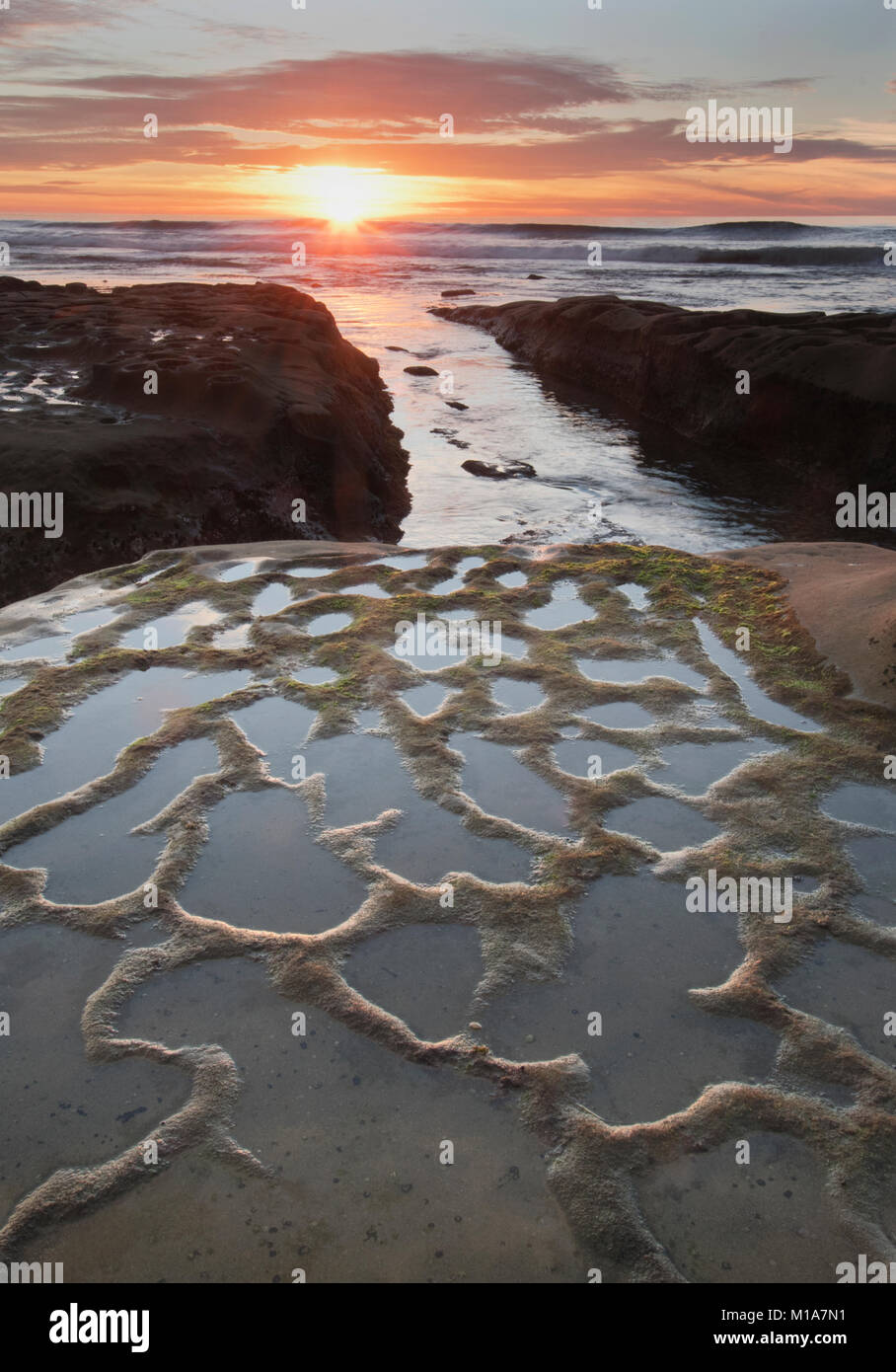 Sunset and eroded rocks, La Jolla, California Stock Photo