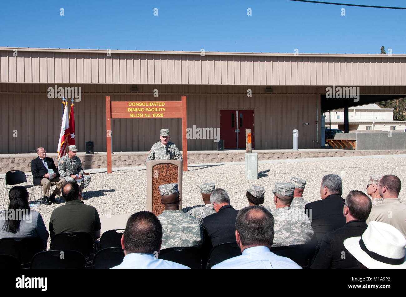 Maj. Gen. Lawrence A. Haskins, Commander California Army National Guard, US Congressman Sam Farr, and Col. John N. Haramalis, Camp Roberts Commander, unveil the new dining facility on Camp Roberts, along with a tour of two other new training facilities, May 13, 2014. The new 8,600 square-foot dining facility will be utilized by thousands of members of the military who train at camp Roberts  annually. (Air National Guard photo by Master Sgt. Julie Avey) Stock Photo