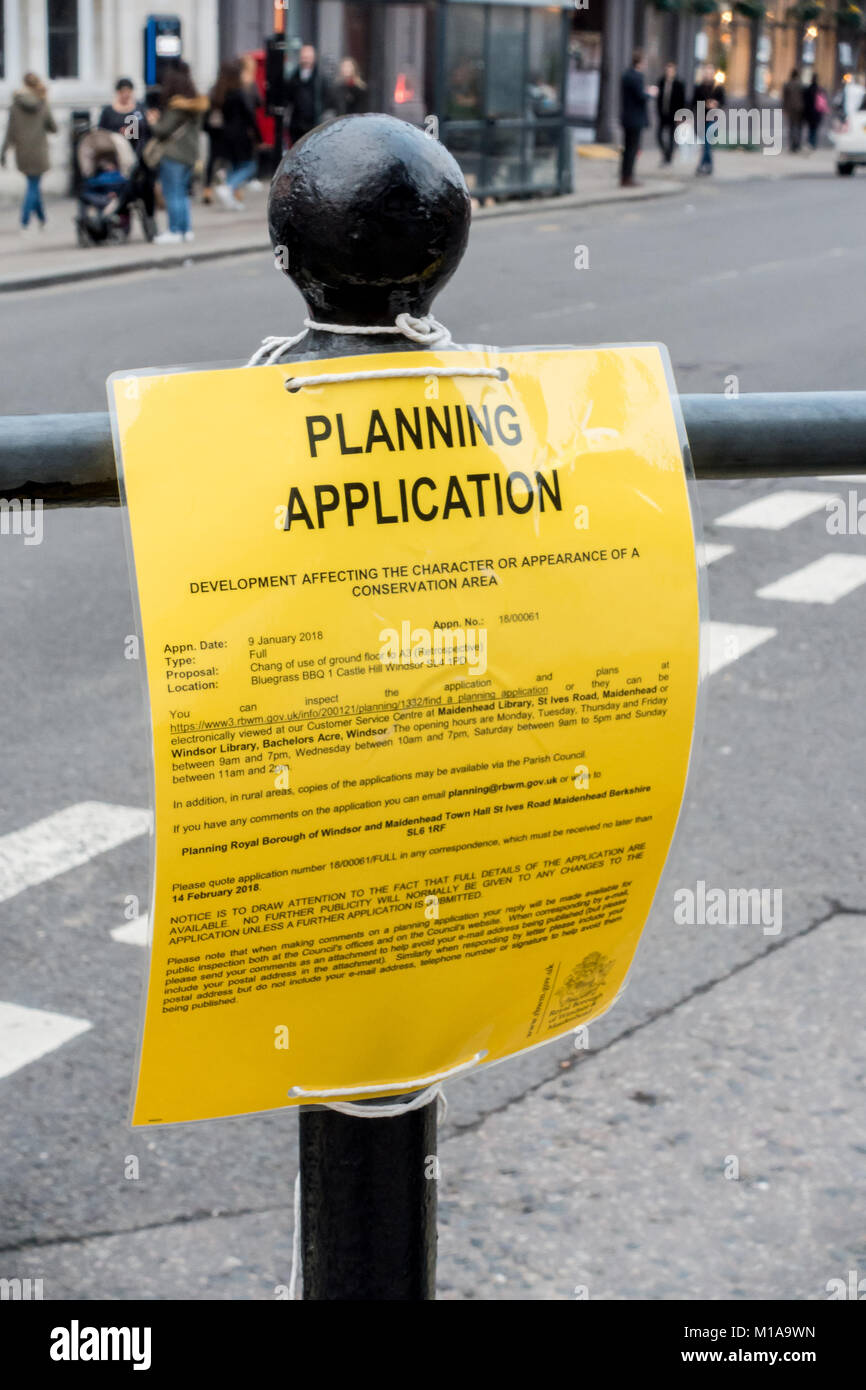 A planning application notice attached to a bollard in Windsor contains a spelling error. Stock Photo