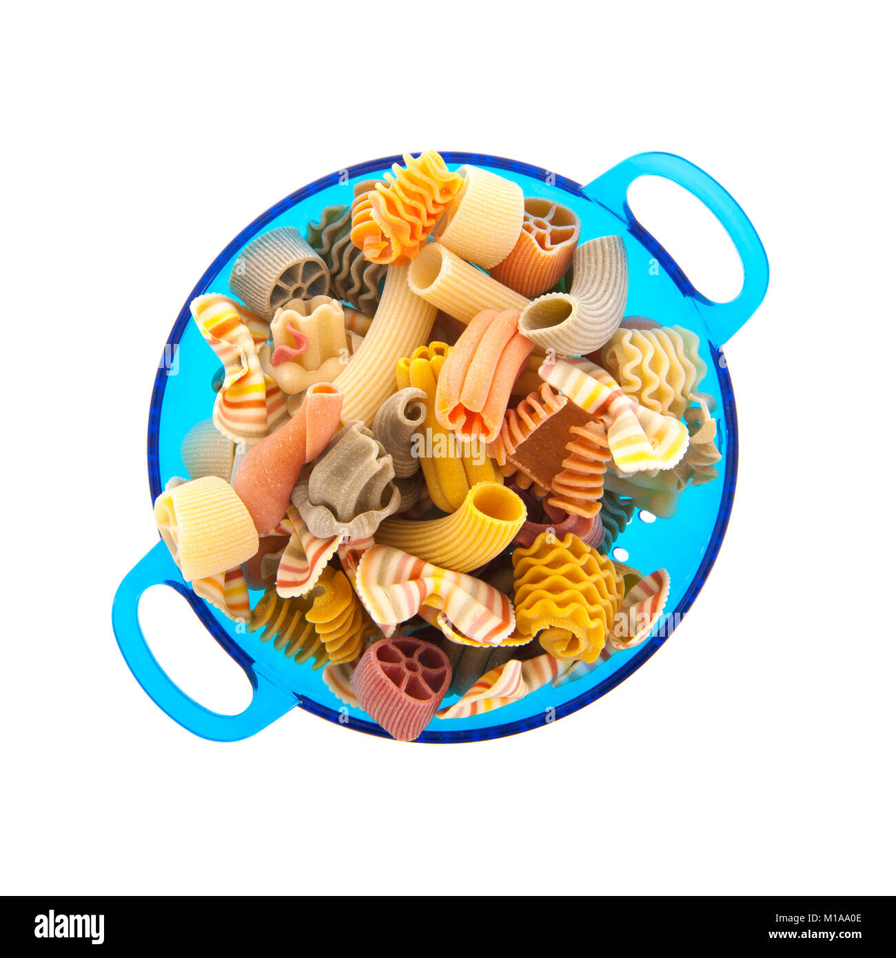 Mixed italian pasta in colander isolated over white background Stock