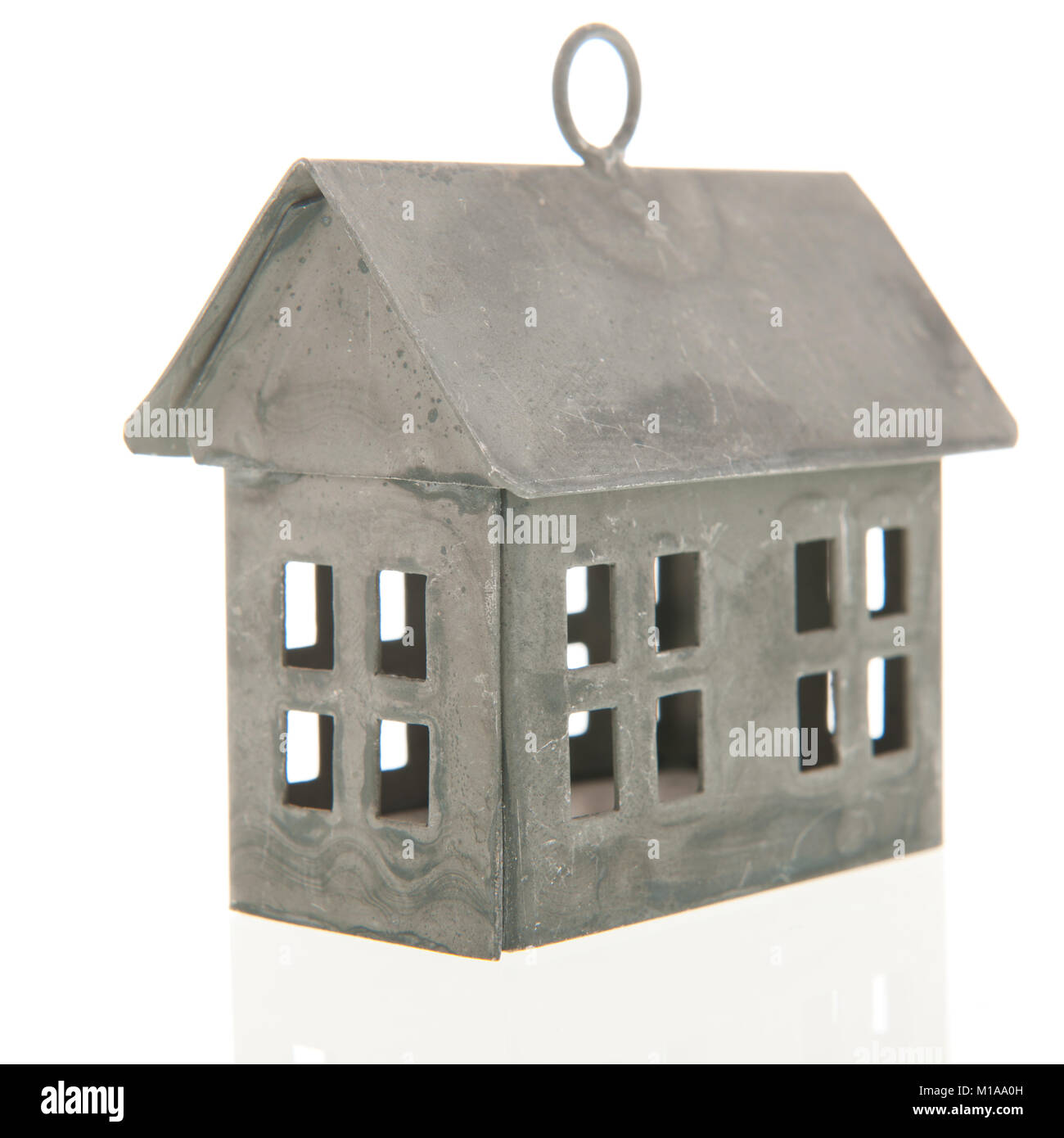 Metal miniature house isolated over white background Stock Photo - Alamy