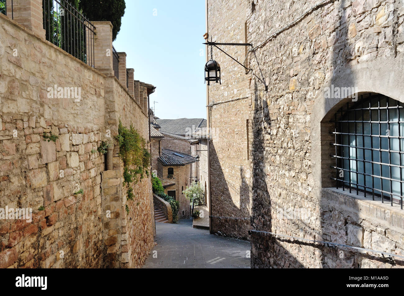 Medieval street in the Italian hill town of Assisi. The traditional ...