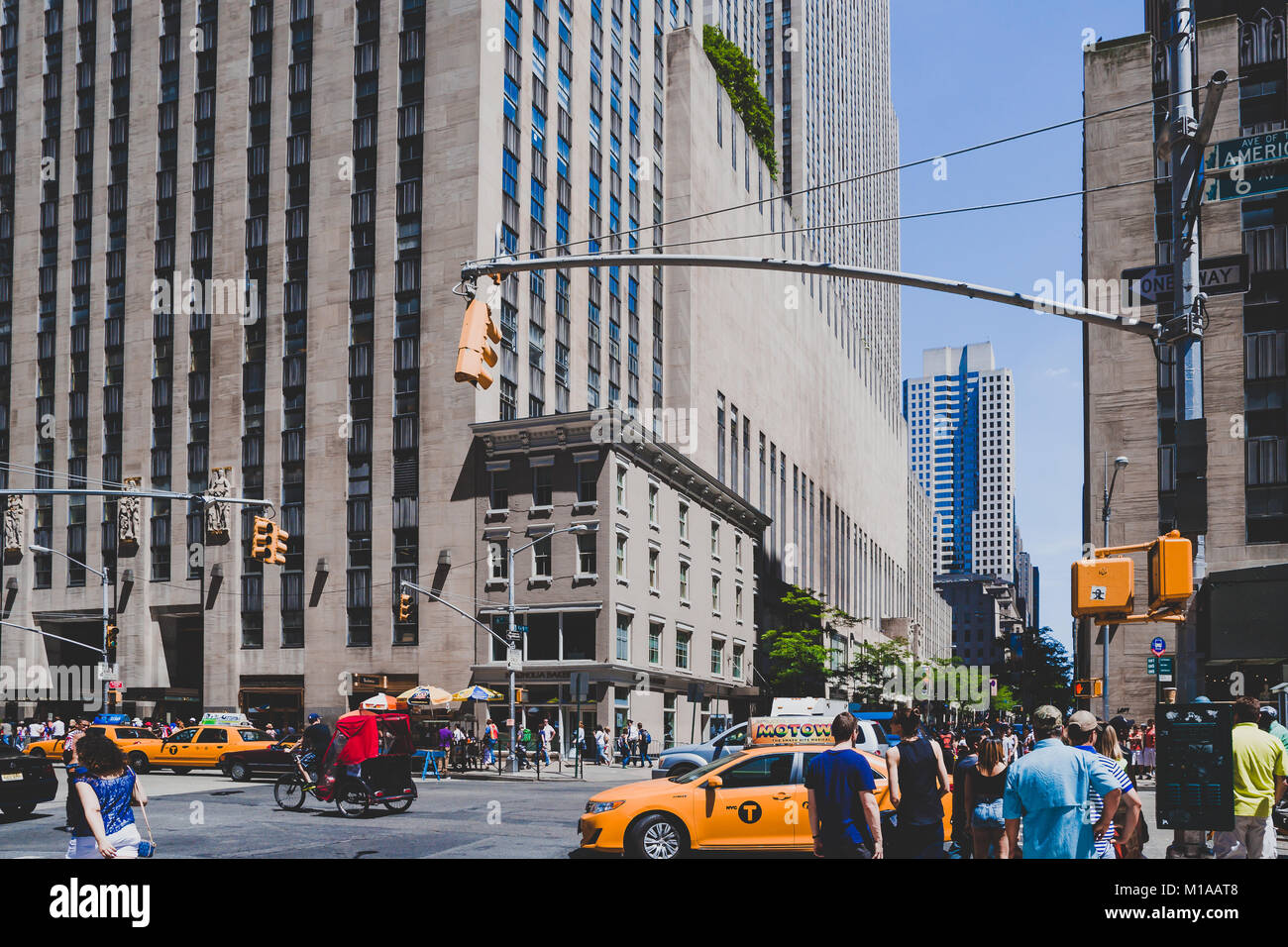 NEW YORK, NY - June 8th, 2014: Manhattan street with yellow cabs and ...