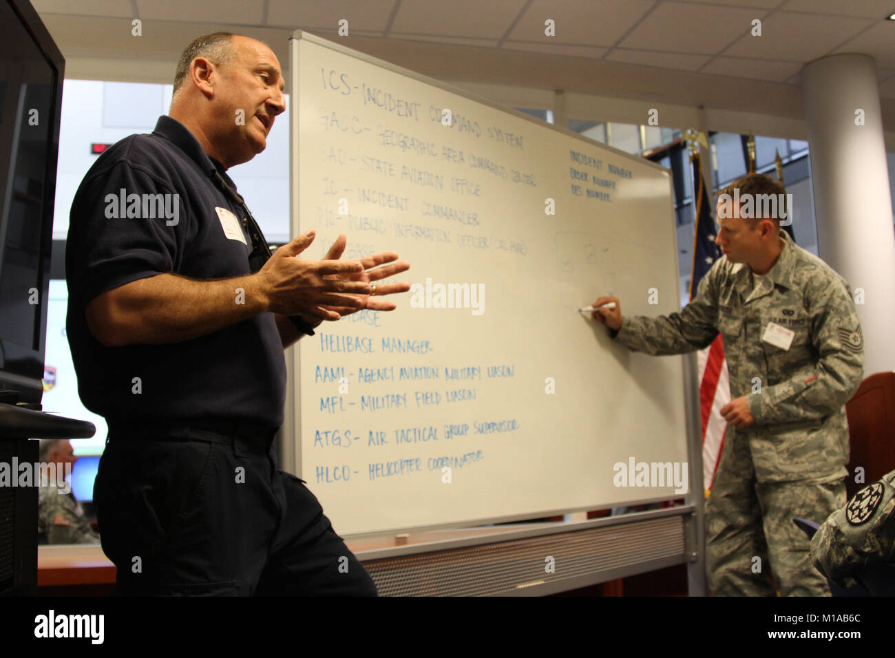 Retired CAL FIRE battalion commander Scott Watson, left, explains ...